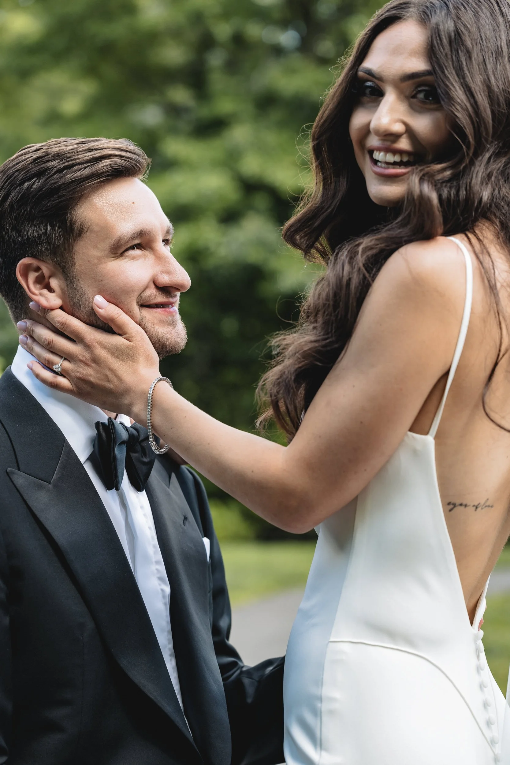 Romantic touch between bride and groom on their wedding day in Connecticut