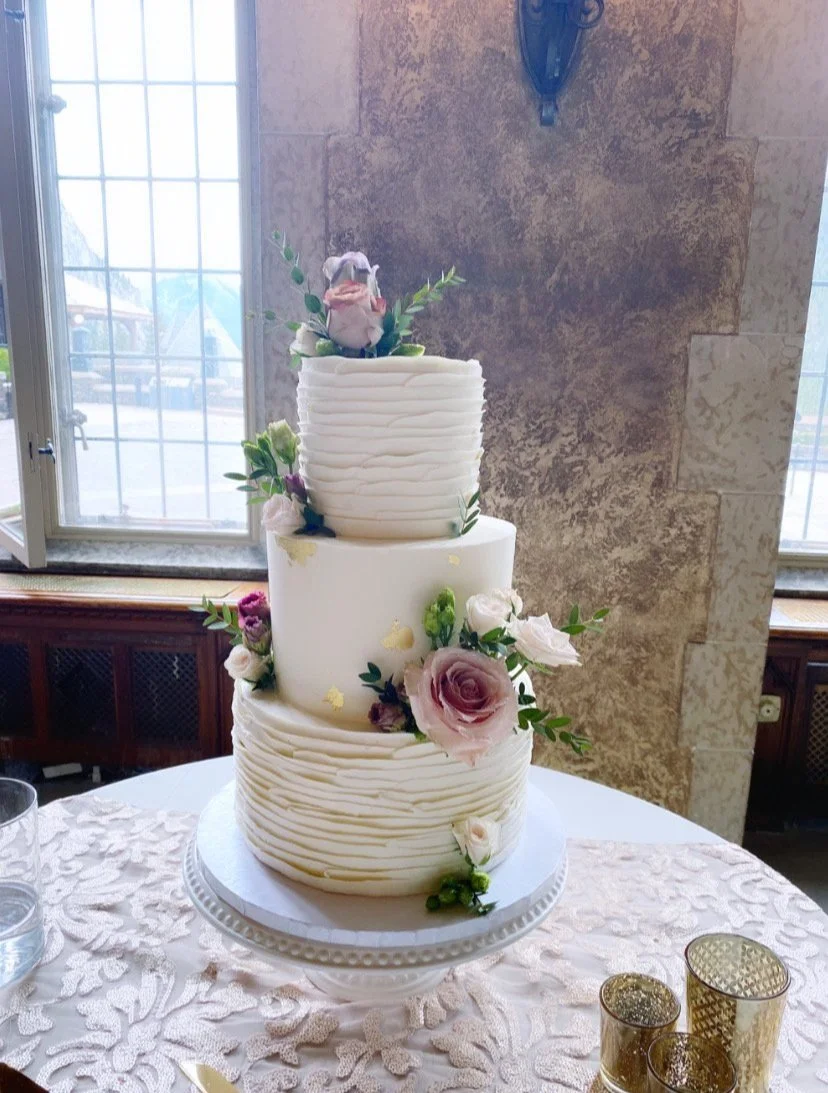 Piped and ruffled buttercream with fresh flowers