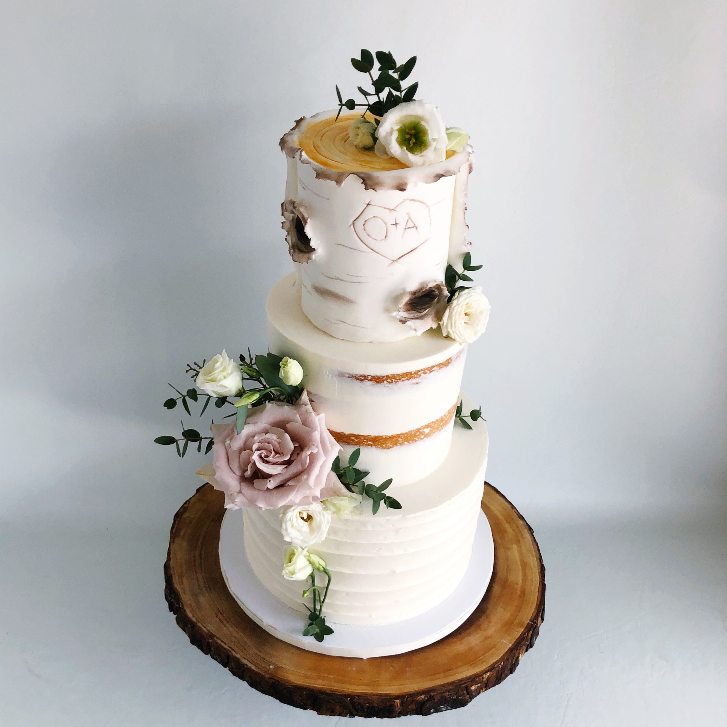 Buttercream birch, semi-naked, and pallet knife designs with fresh flowers