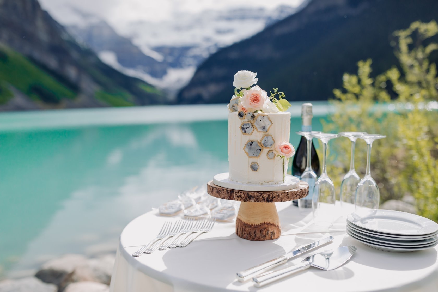 Soft buttercream design with marbled fondant hexagons and fresh flowers