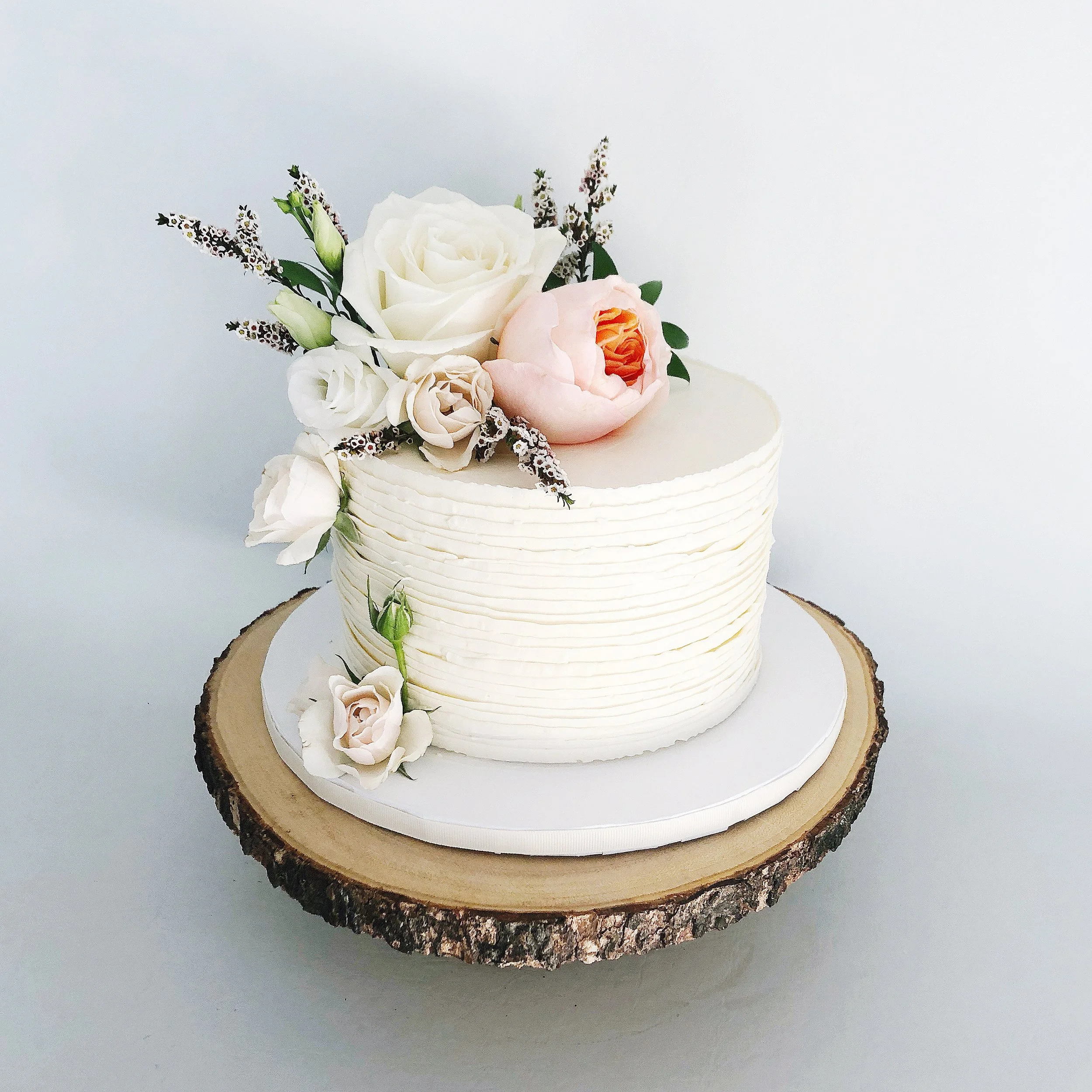 Piped buttercream ruffles with fresh flowers