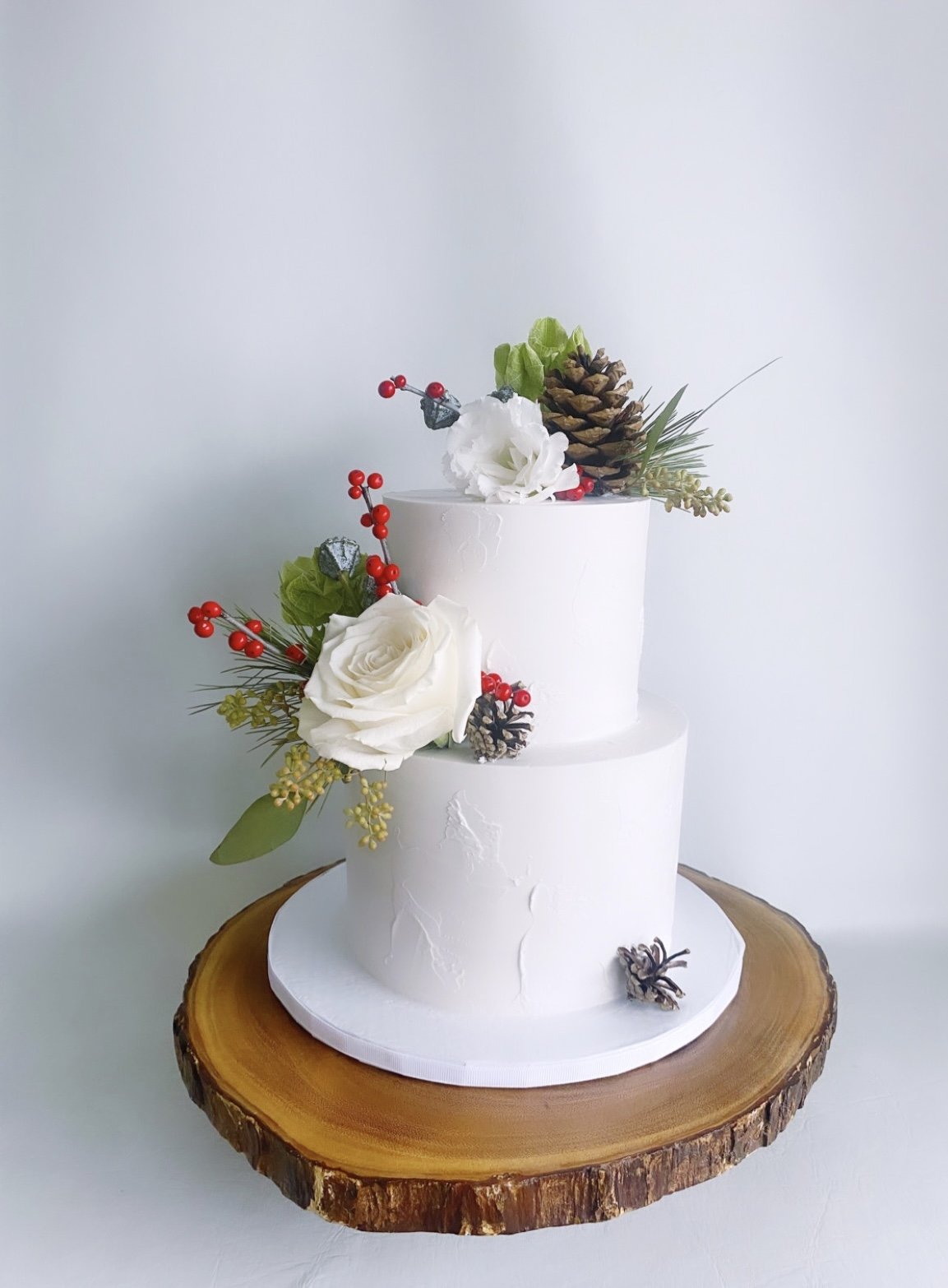 Soft, textured buttercream design with fresh florals