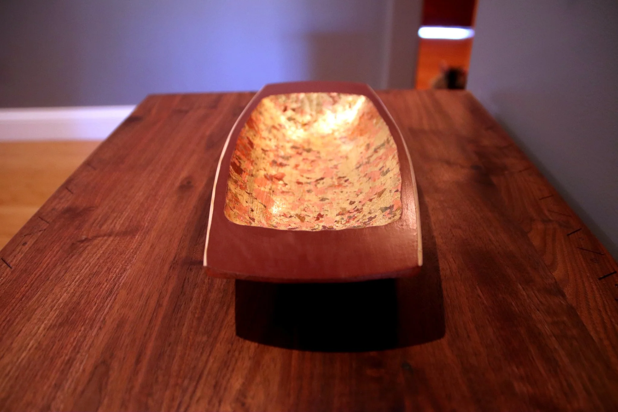 Carved cypress bowl with metal flake and barn red milk paint