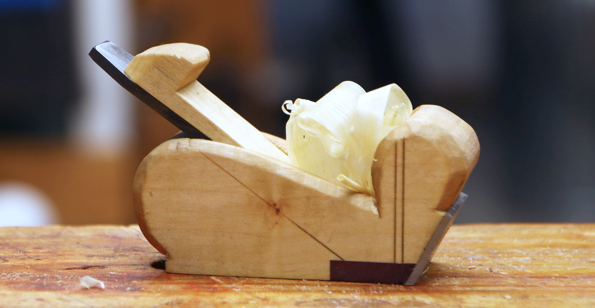Wooden bullnose plane with shavings