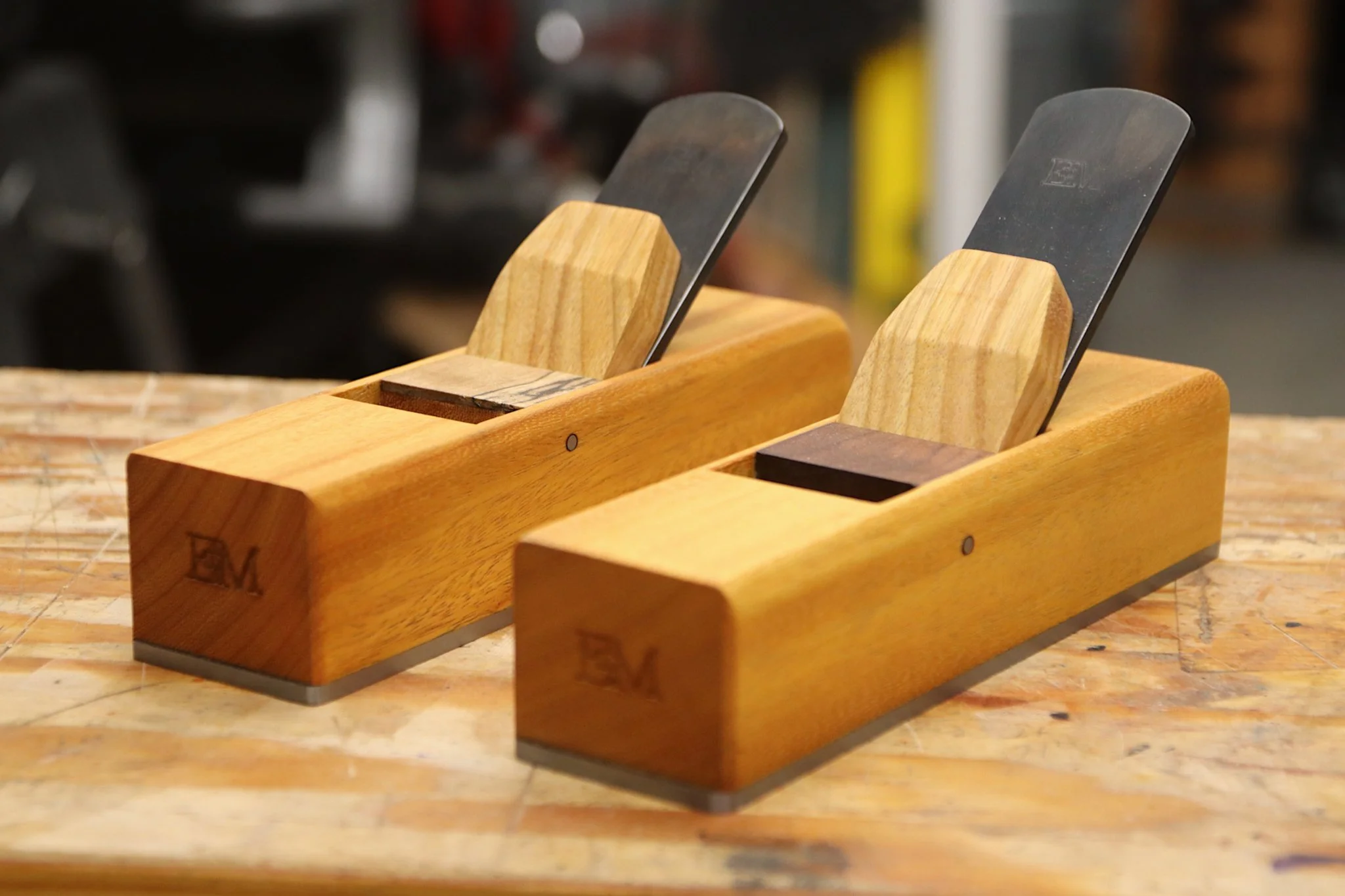 Two miter planes sitting on a bench