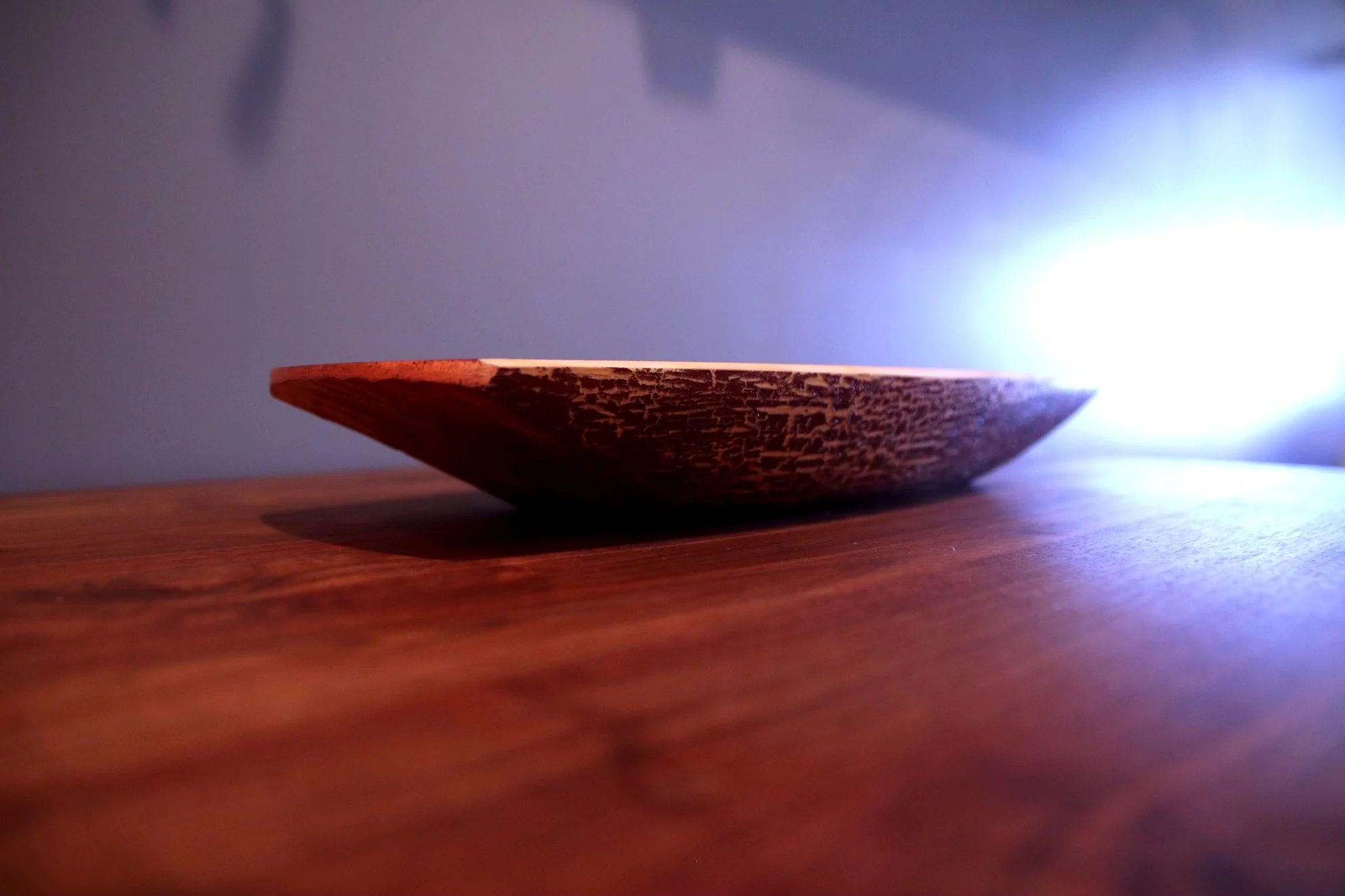 Carved cypress bowl with metal flake and barn red milk paint
