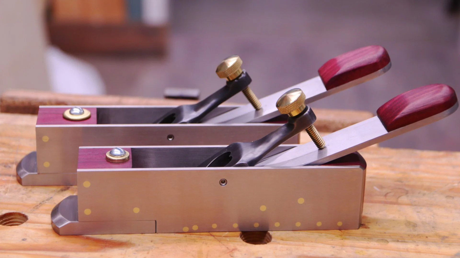 2 miter planes made from stainless steel with purple heart infills