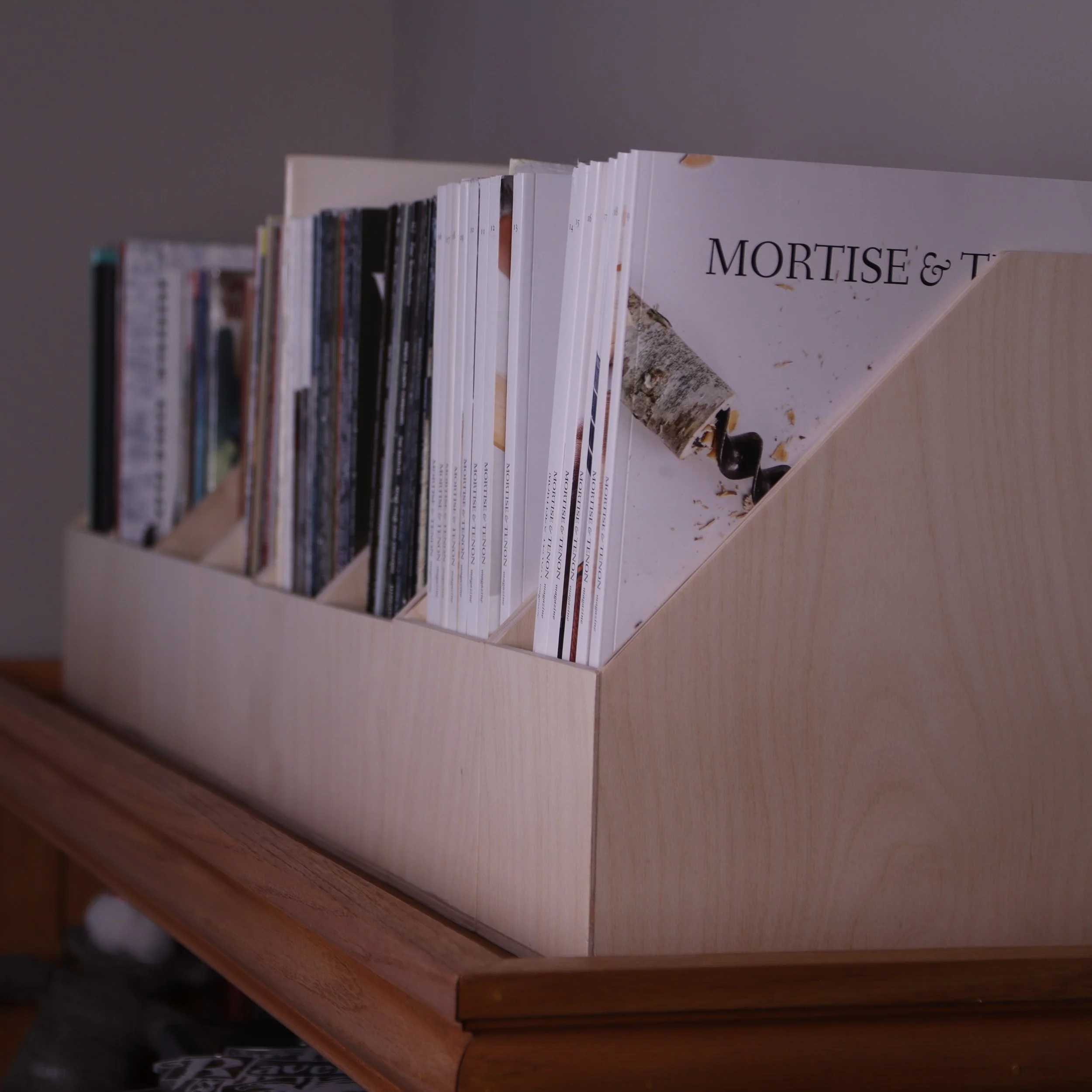 Baltic birch magazine file holders filled with magazines.