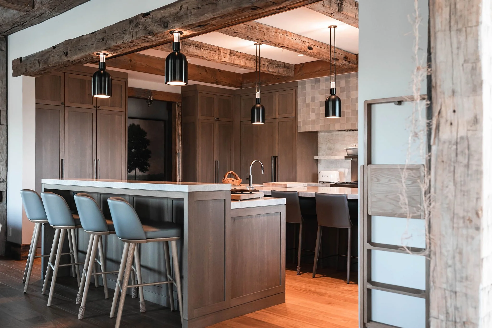 Where modern design meets rustic charm.

At Hilltop Hideaway, the kitchen is the heart of the retreat &mdash; balancing entertaining and everyday living.

Natural wood tones, statement lighting, and custom cabinetry create a warm but elevated feel.

