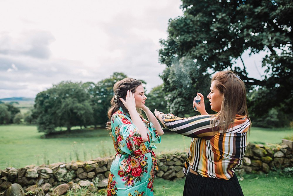TB OUTSIDE LONGHOUSE GETTING READY BRIDE GIBSONS.jpg