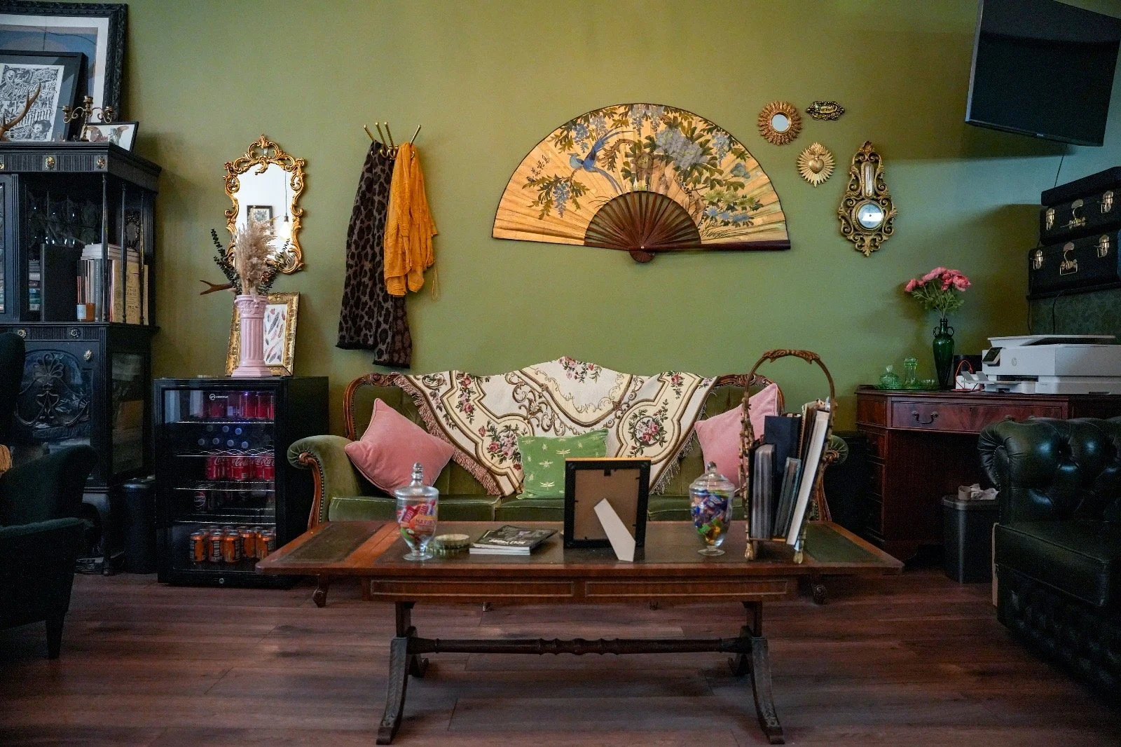 Sofa and wall decorations at Heart of Glass Tattoo studio