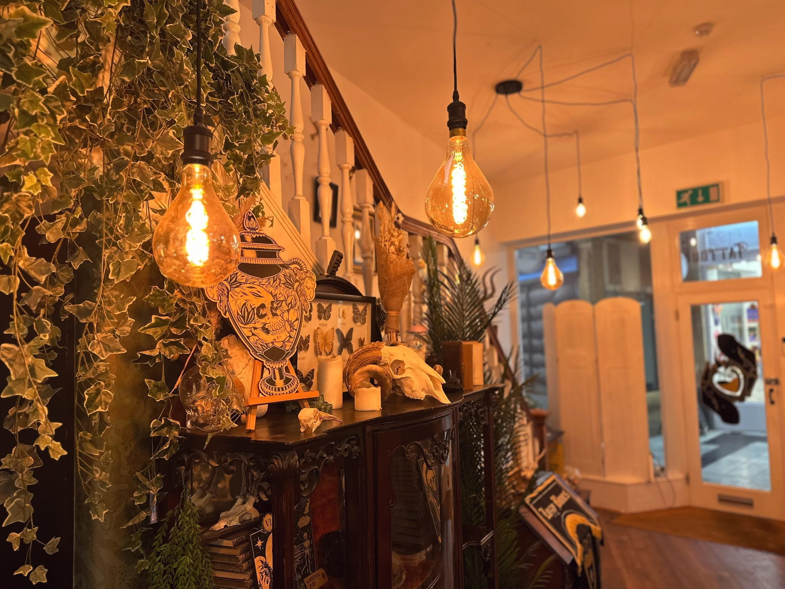 Staircase and decorative lights at Heart of Glass Tattoo studio