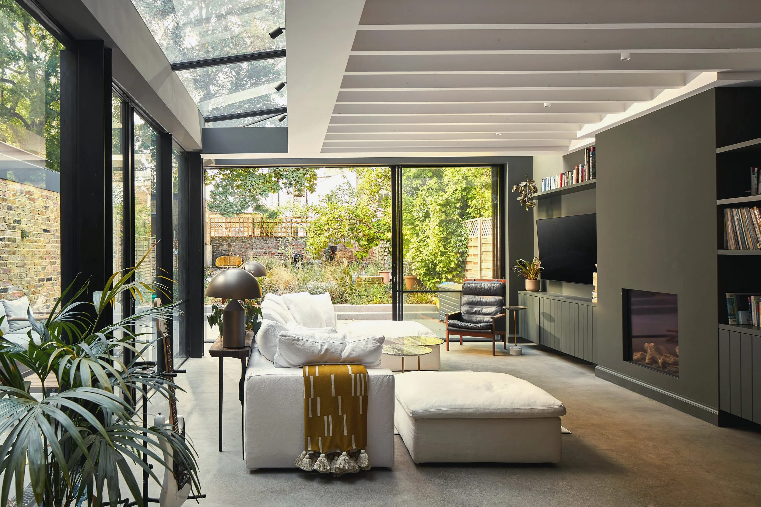 a contemporary glass rear extension with large sliding doors 