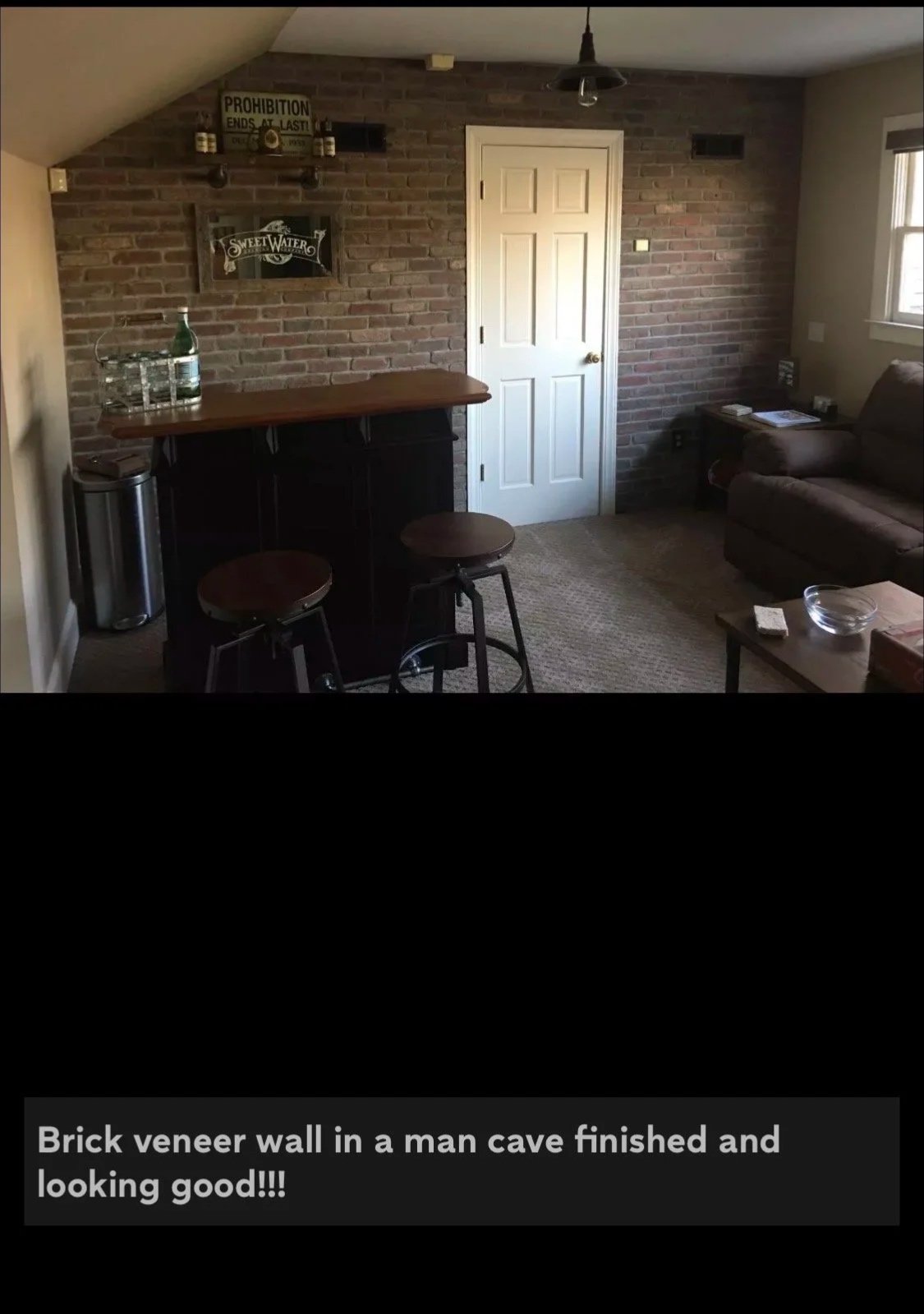 Completed brick veneer wall in man cave. This man is beyond happy!!