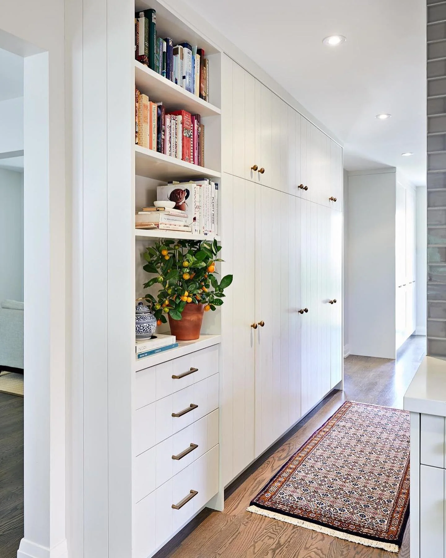 A throwback to the kitchen at #projectchiltern 

The clients were a busy young family, in major need of storage. We utilized the hallway leading from the kitchen to the entryway to give them a full service storage unit, used for both pantry and a coa