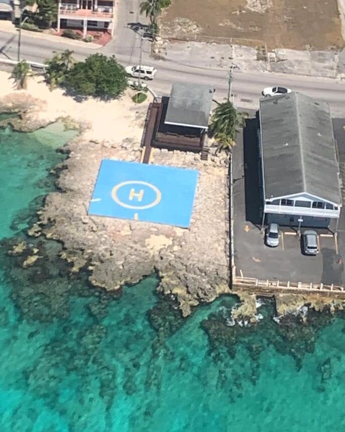 Our shop looks so cute from up here. 🤩 Do you know what the lines down on the helipad mean? Comment below! 
&bull;
&bull;
&bull;
&bull;
#cihelicopters 
#helipad 
#wayuphigh 
#emeraldbluewater