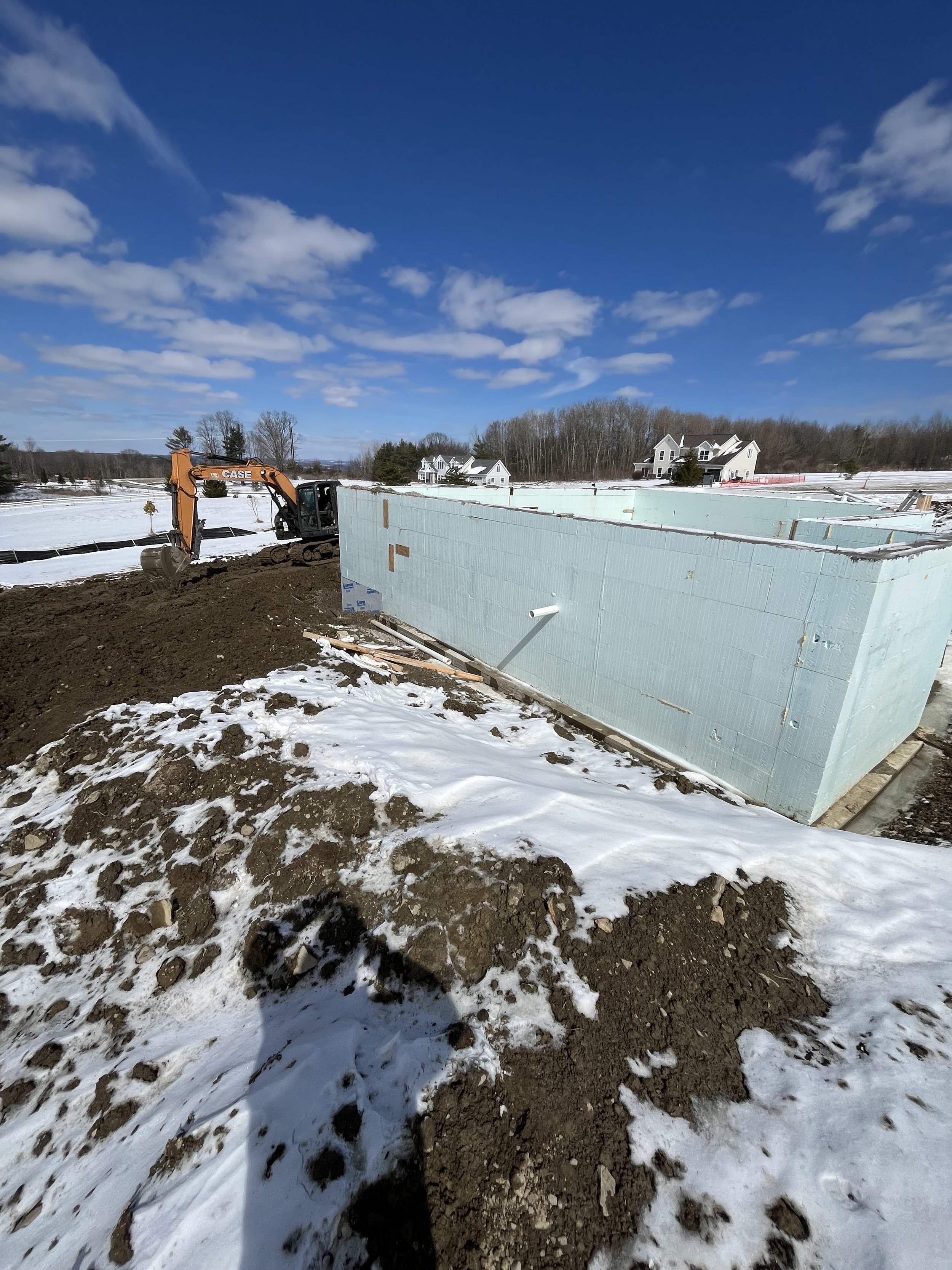 Excavator digging a house foundation