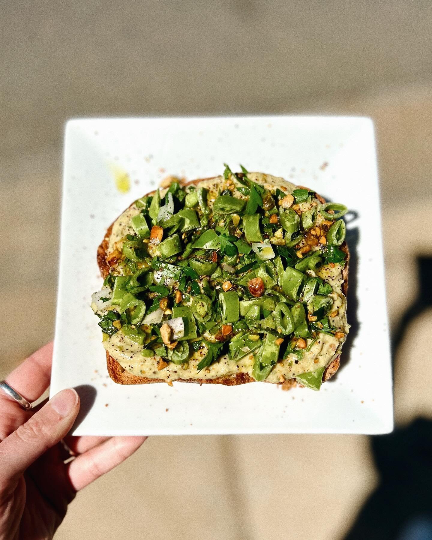 Have you tried the Very Verdant Victual yet? Our current toast special made by @houseflyvictuals is the perfect spring-y snack&hellip;zucchini baba ganoush, snap pea + herb salad, and an herby infused oil 🤩 Getcha some &lsquo;till the end of the mon
