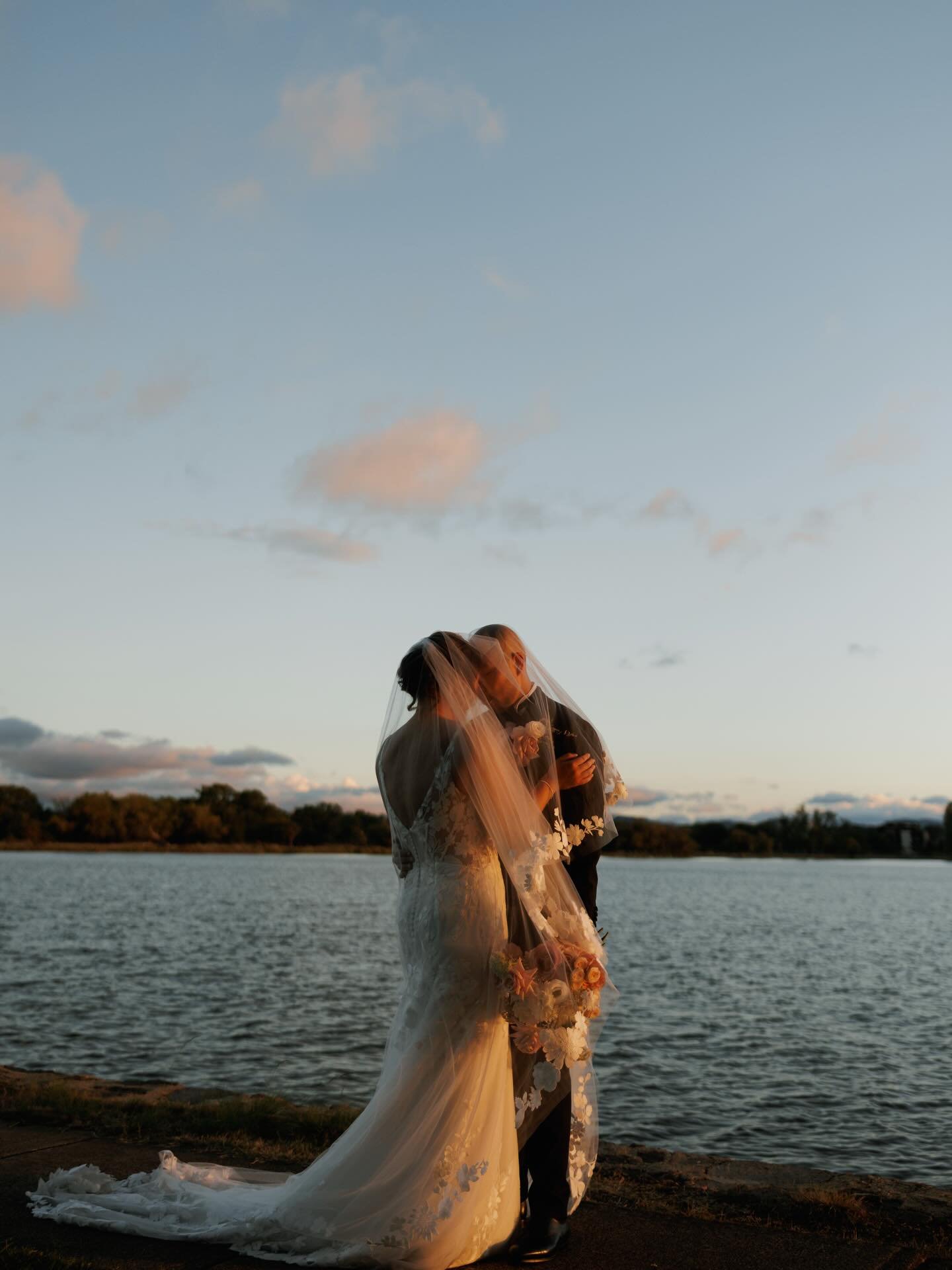 Lea &amp; Simon 🤍. A lakeside wedding, golden light, and the best kind of celebration.
.
.
&bull; Venue: @theboathousecbr 
&bull; Florals: @michicweddingsandevents 
&bull; MUA: @cassandraleehairandmakeup 
&bull; DJ: @djrenkun 
&bull; Videographer: @
