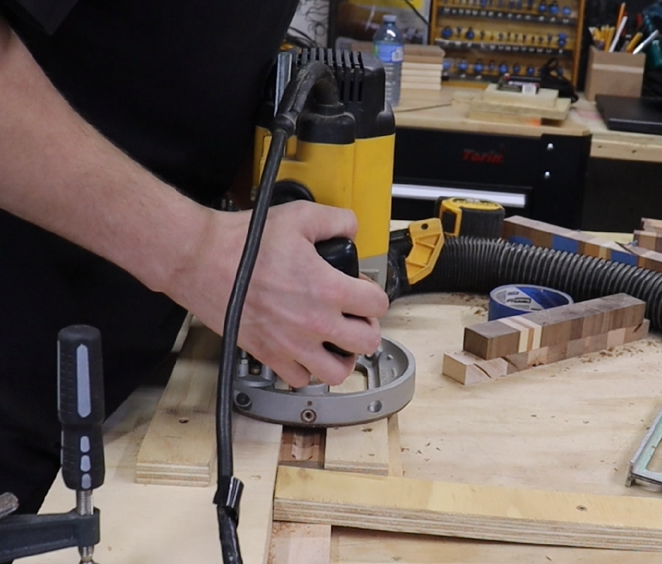  Using a plunge router and makeshift jig to cut center groove into hardwood blank for DIY incense holder. 