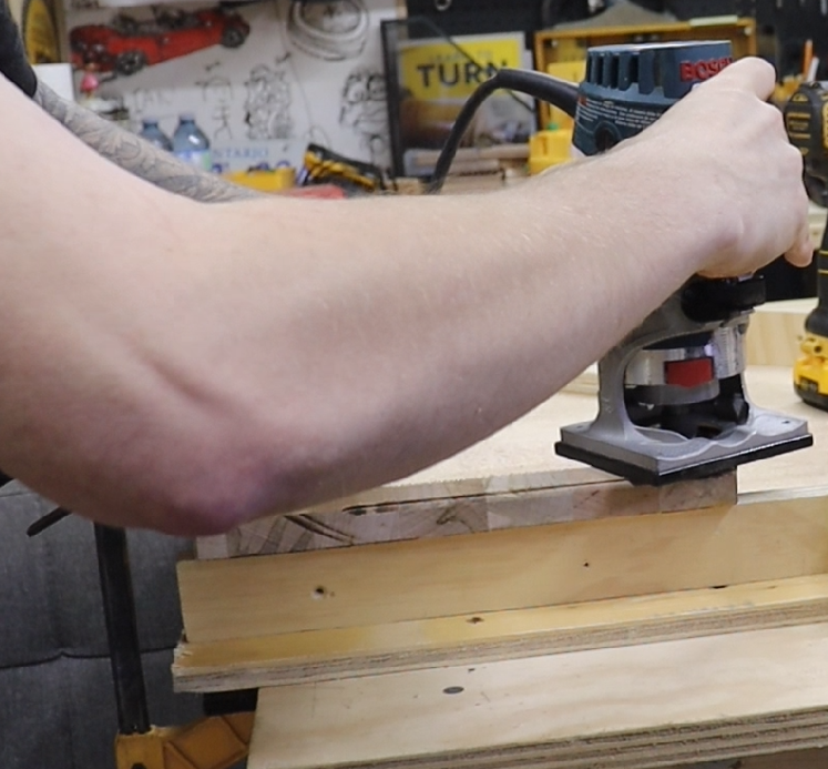  Woodworker rounding over the bottom edge of a DIY incense holder blank to create a floating visual effect. 