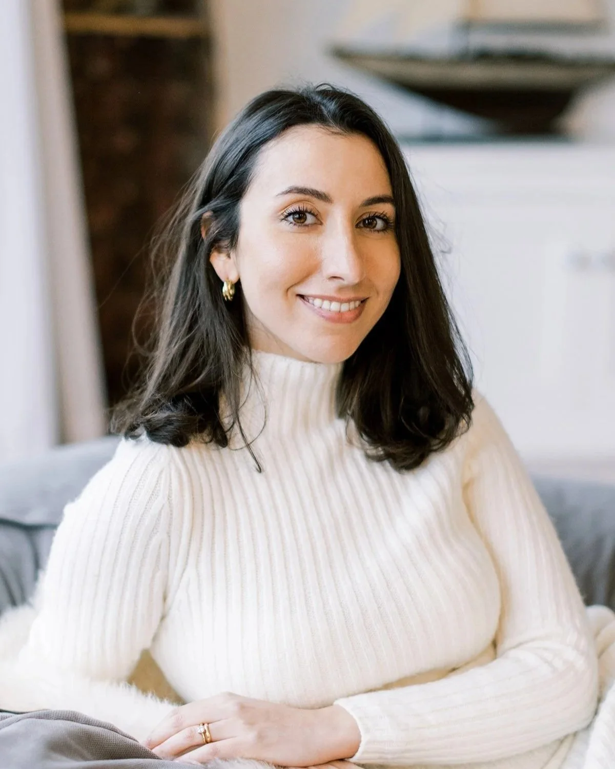 Portrait of Victoria Locke, a woman in her thirties with fair complexion and mid-length dark brown hair.