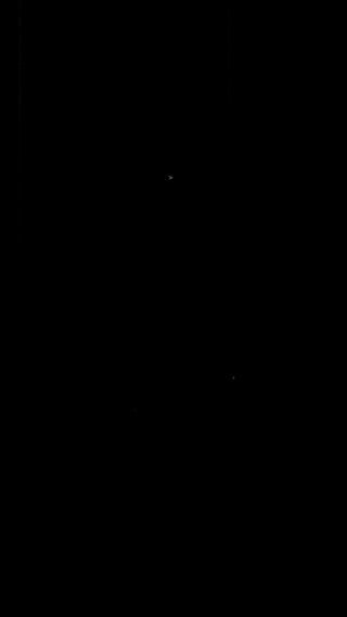 Black-and-white image of a vintage airplane flying in the sky.