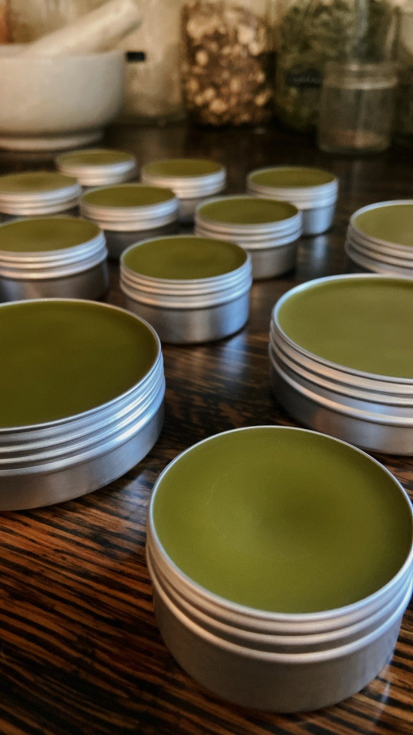 Mama and baby herbal oil salve with calendula, plantain, and marshmallow root for soothing sensitive skin, nipple care, diaper rash, and promoting healing of scarring for both mama and baby.