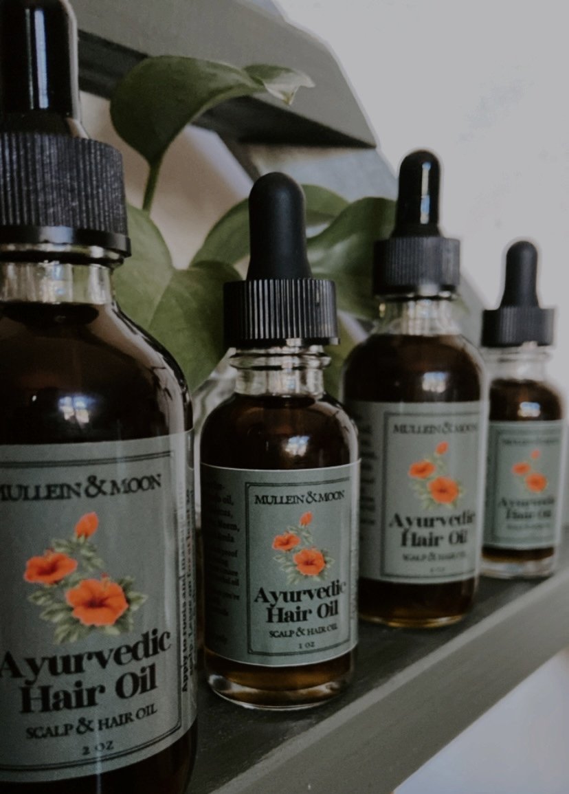 Ayurvedic hair oil with neem, amla, hibiscus, moringa, and nettle for nourishing, strengthening, and promoting healthy hair growth while soothing the scalp