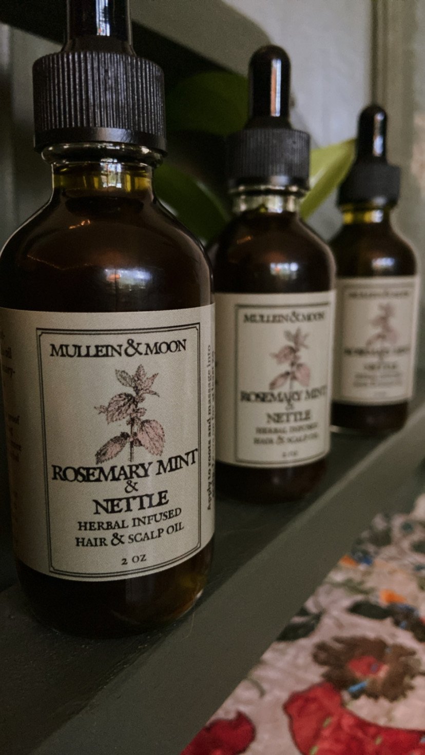 Herbal hair and scalp oil with rosemary, mint, and nettle for promoting healthy hair growth, soothing the scalp, and reducing dandruff