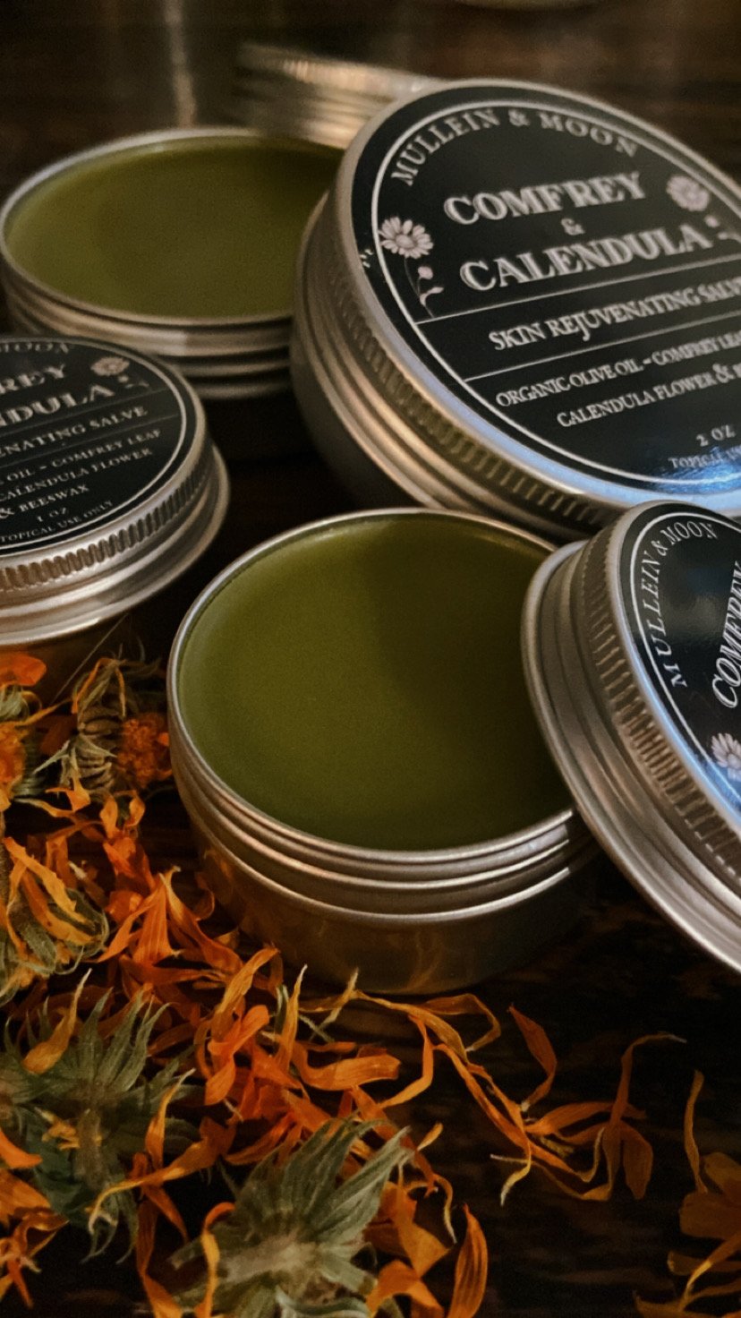 Herbal oil salve with comfrey and calendula for promoting healing, reducing inflammation, and soothing dry, irritated skin, cuts, and bruises