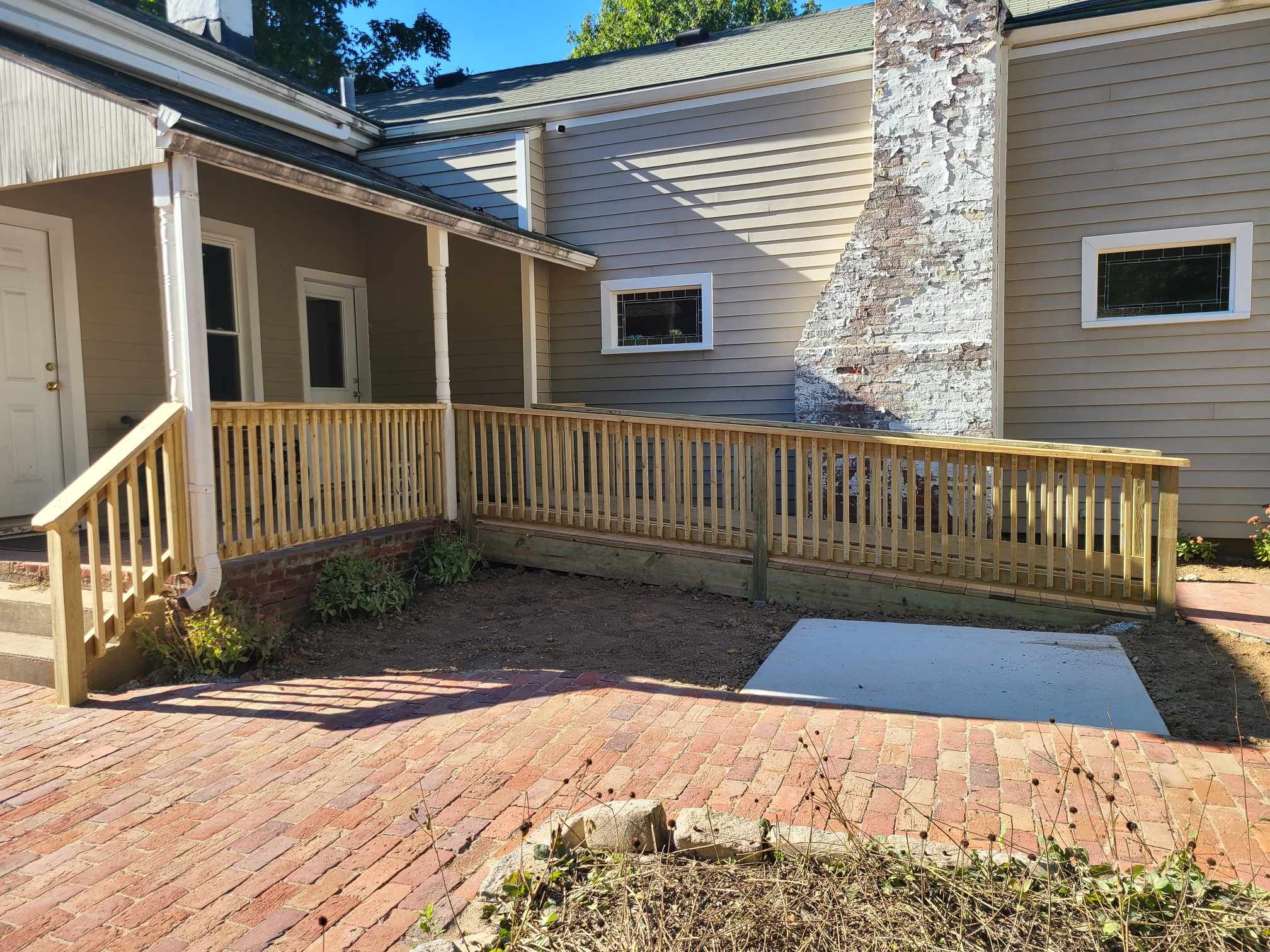 Wheelchair access ramp and balcony handrail. Paver pathway washed and refurbished.