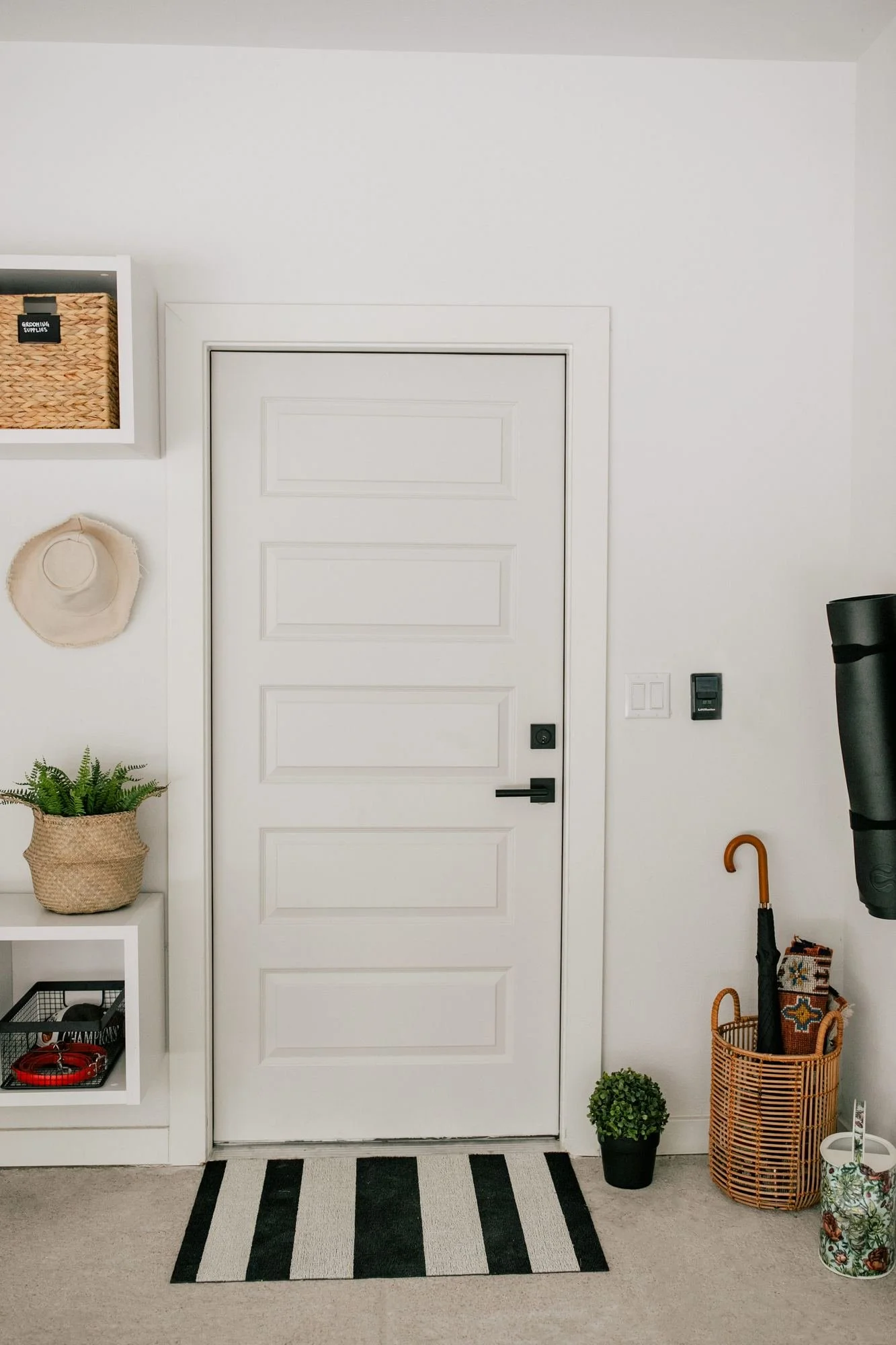 garage-entry-door-striped-mat-umbrella-basket.jpg