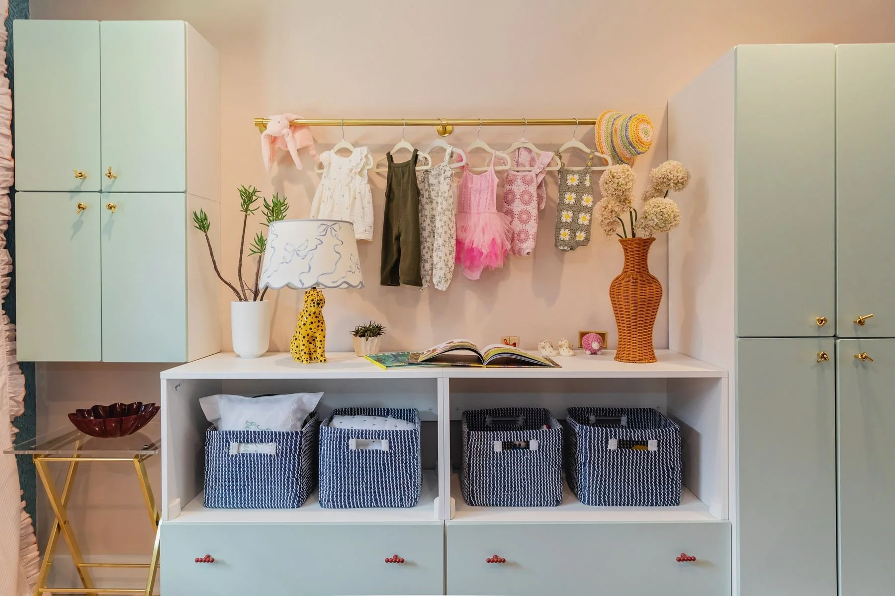 houston-playroom-storage-wall-mint-cabinets-woven-baskets.jpg