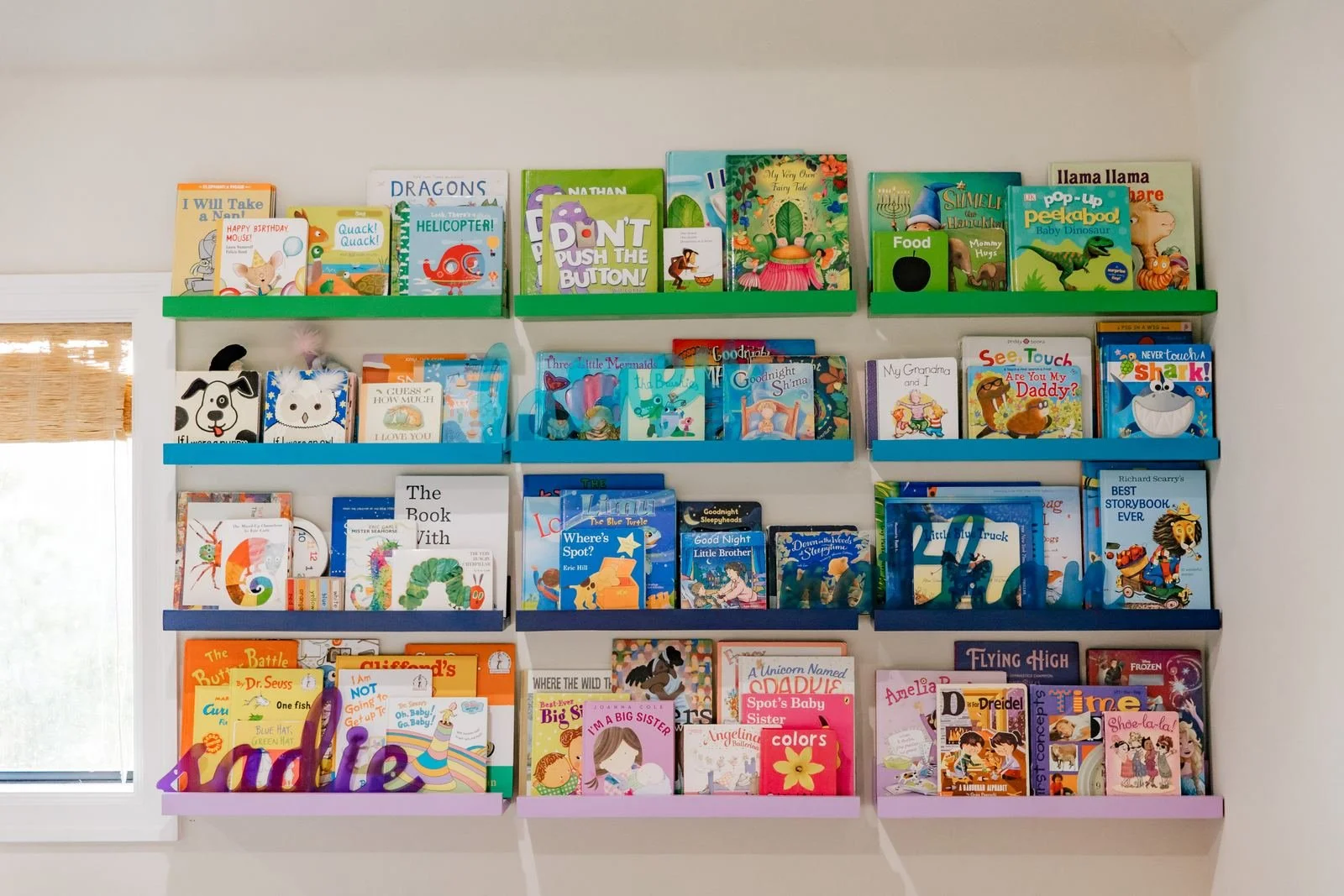 rainbow-painted-book-ledges-kids-library.jpg