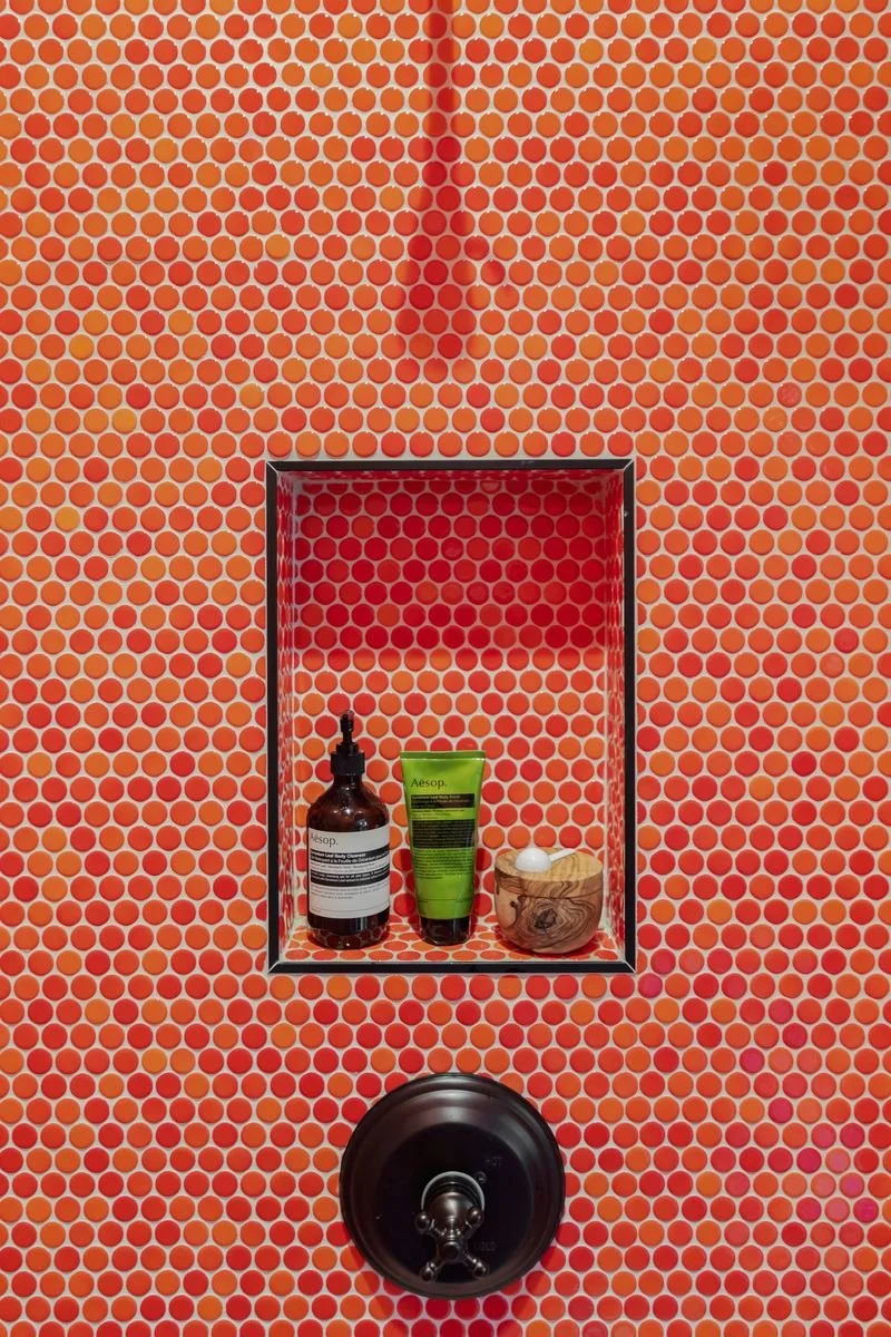 orange-penny-tile-shower-niche-houston-bathroom.jpg