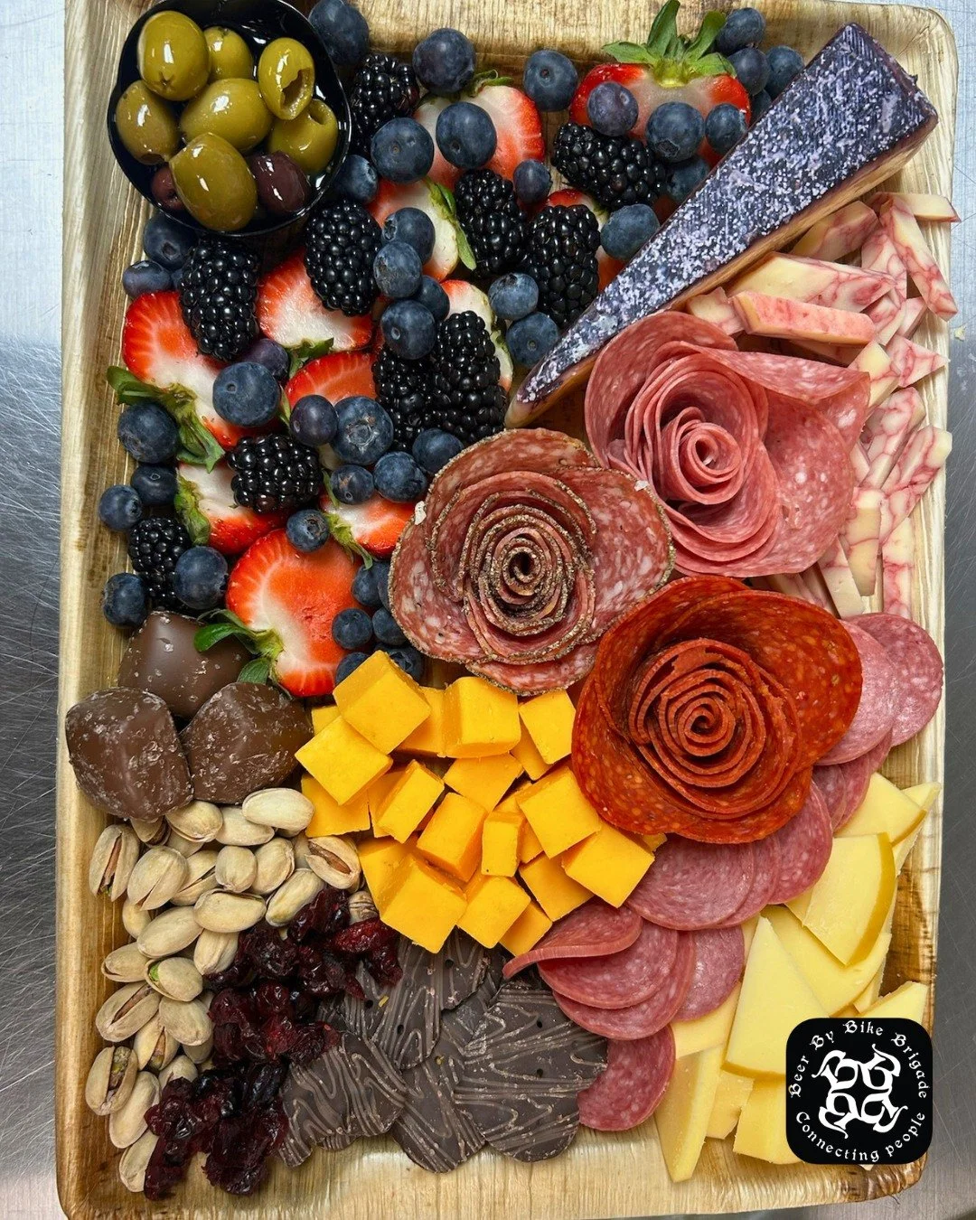Making Monday delicious! 😋 Check out the @beerbybikebrigade app to reserve a board like this for the same great taste at a lower price: https://loom.ly/0hJRxek.

#HuntAndGatherGrazing #Charcuterie #SmallBusiness #BeerByBikeBrigade #DowntownLaCrosse