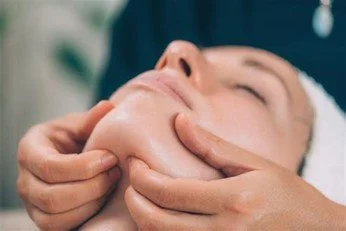 Close-up of someone receiving a massage on their back.
