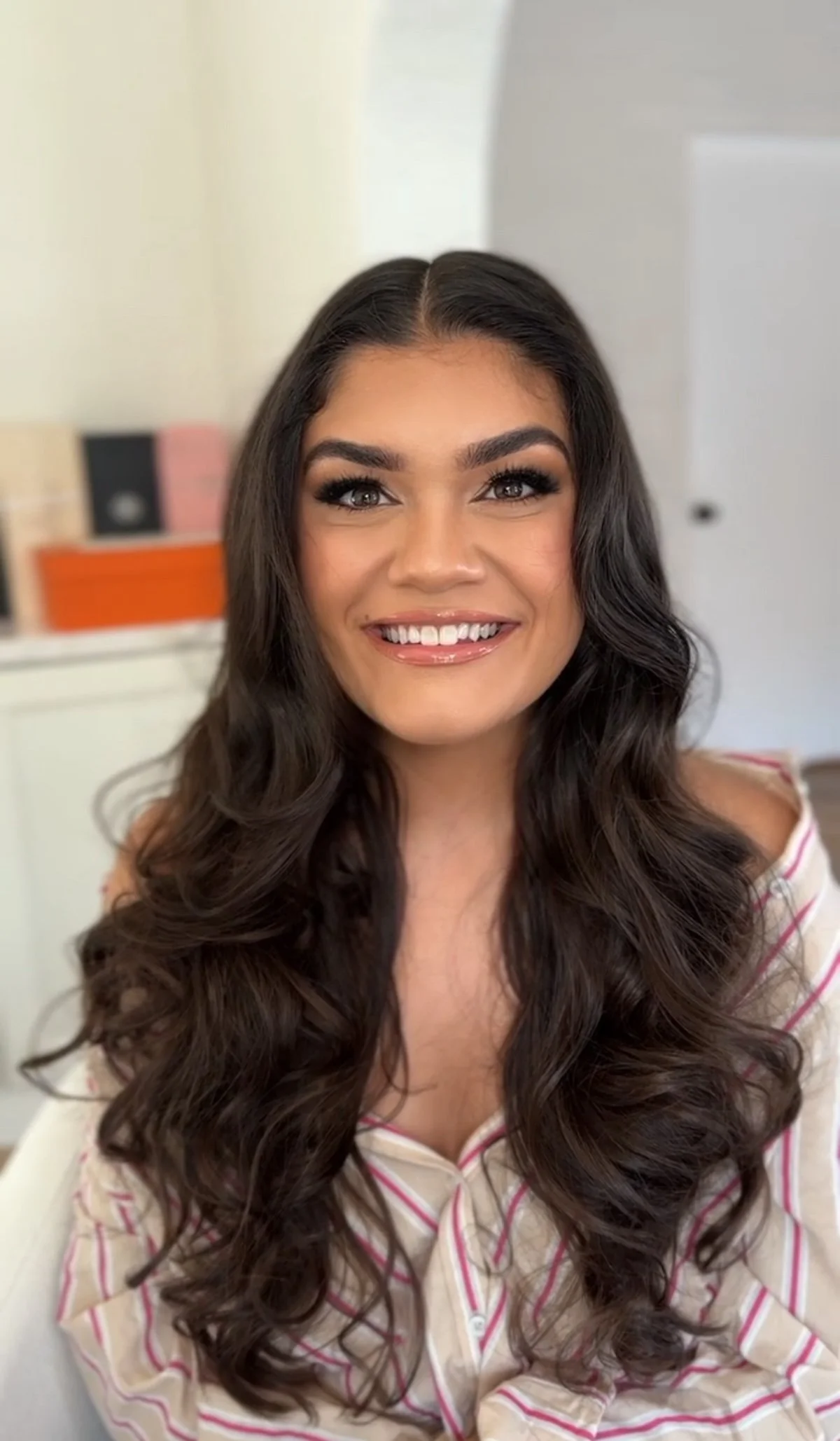 engagement soft glam enhancing makeup with neutral eye and glossy lip and bouncy curls long hairstyling