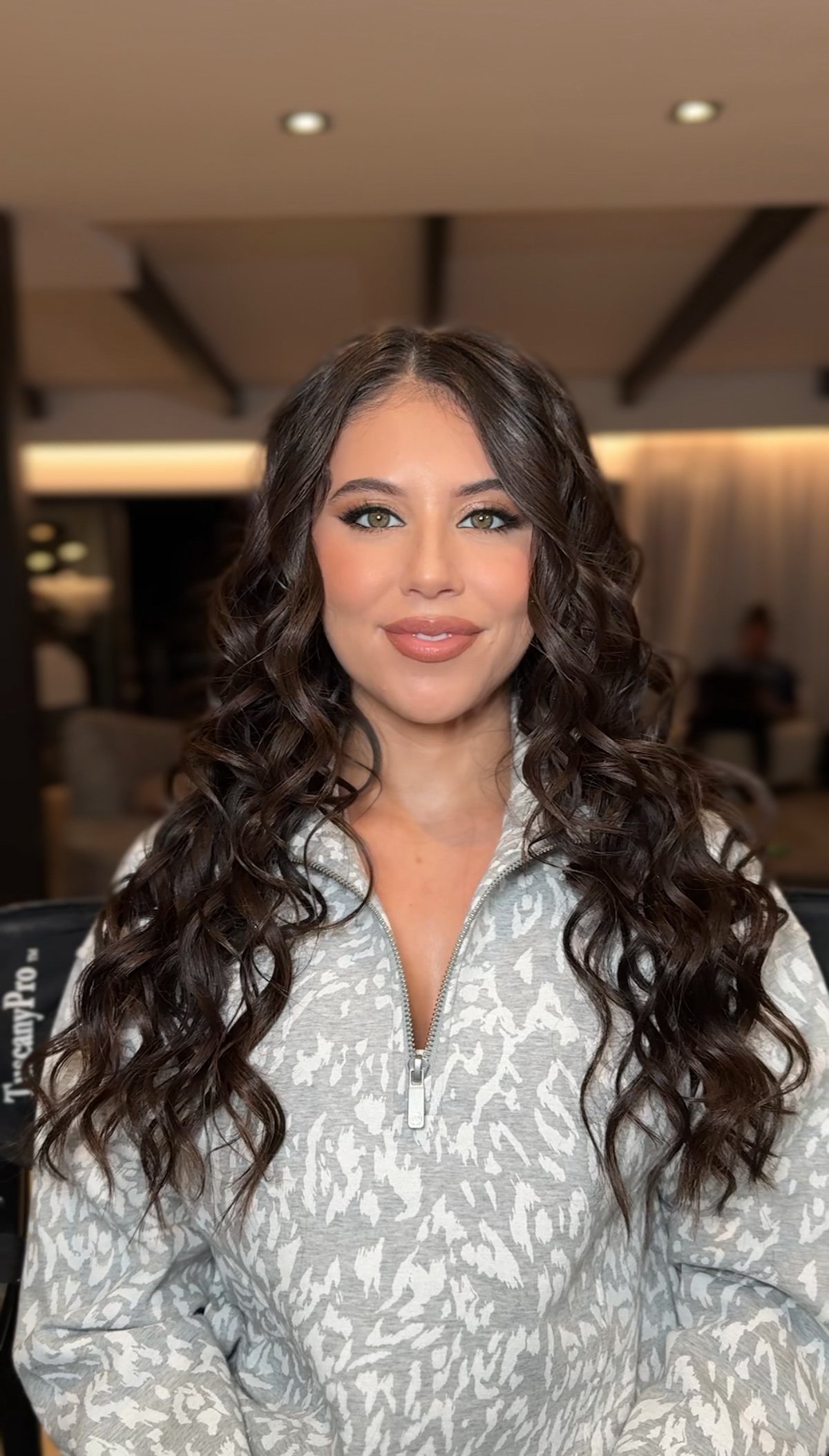 wavy curls and evening soft glam for brunette beauty