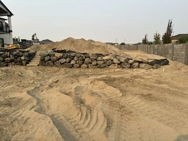 Granite steps with boulder retaining wall