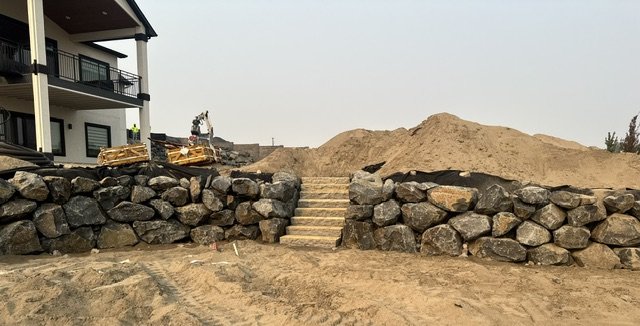 Granite steps with boulder retaining wall