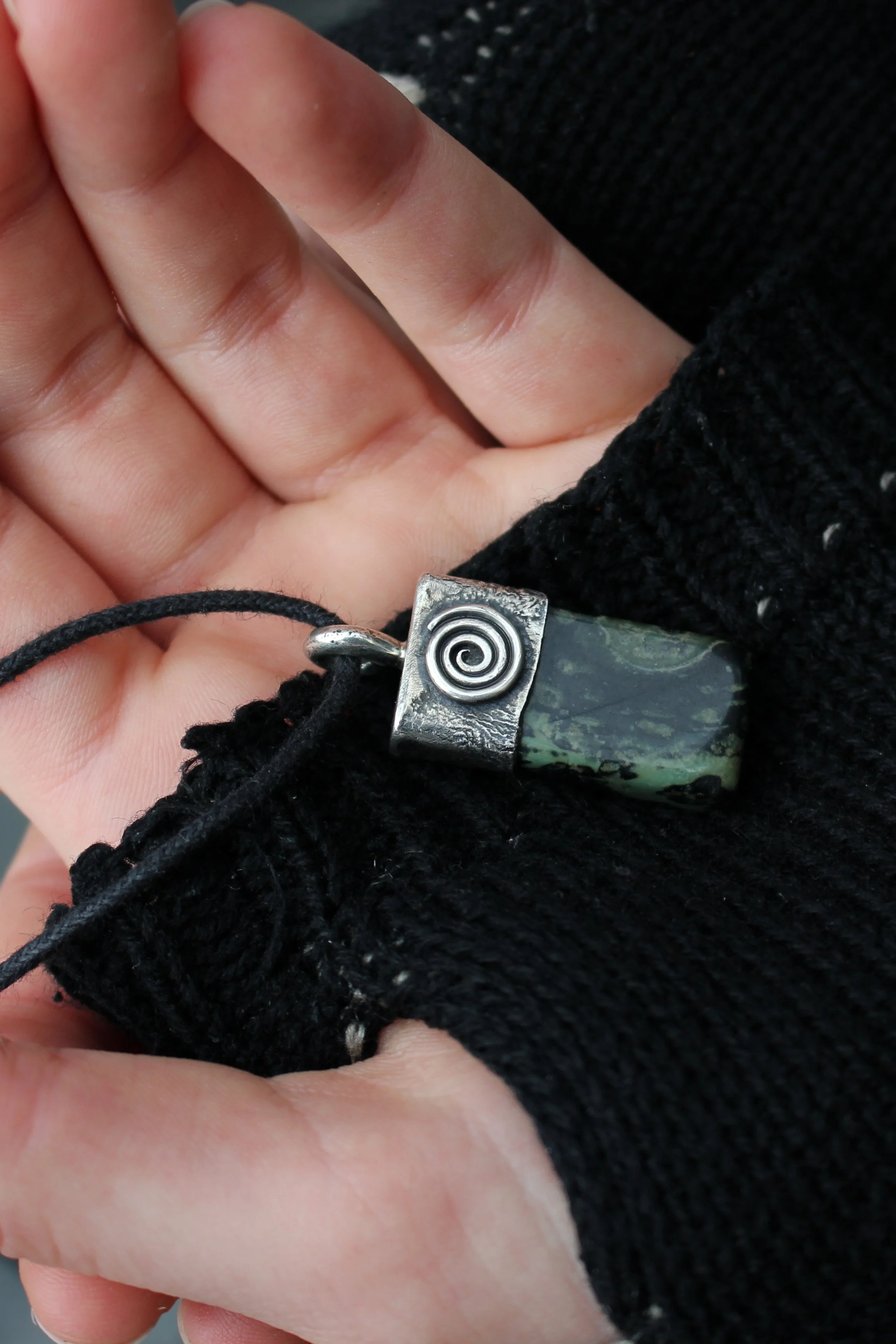Spiral-silver-jasper-talisman-hand.jpg