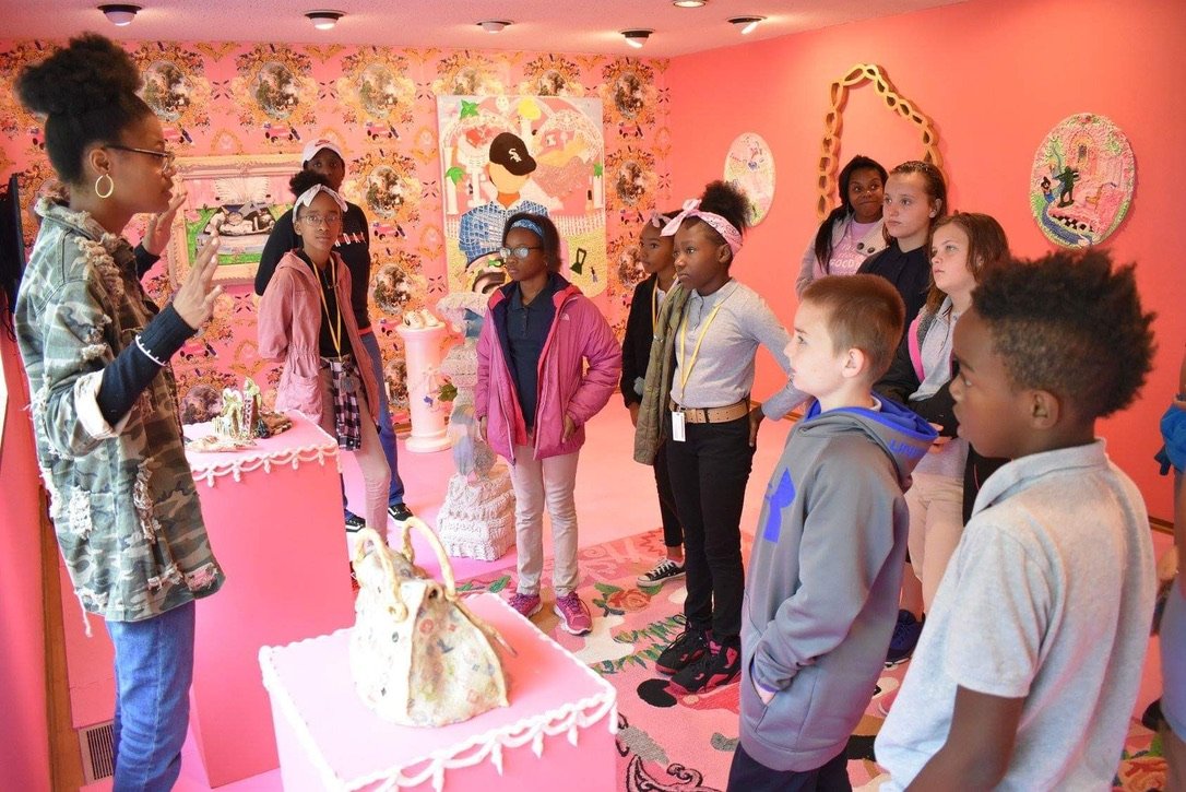 ming tours school children through Yvette Mayorga's installation 'High Maintenance'