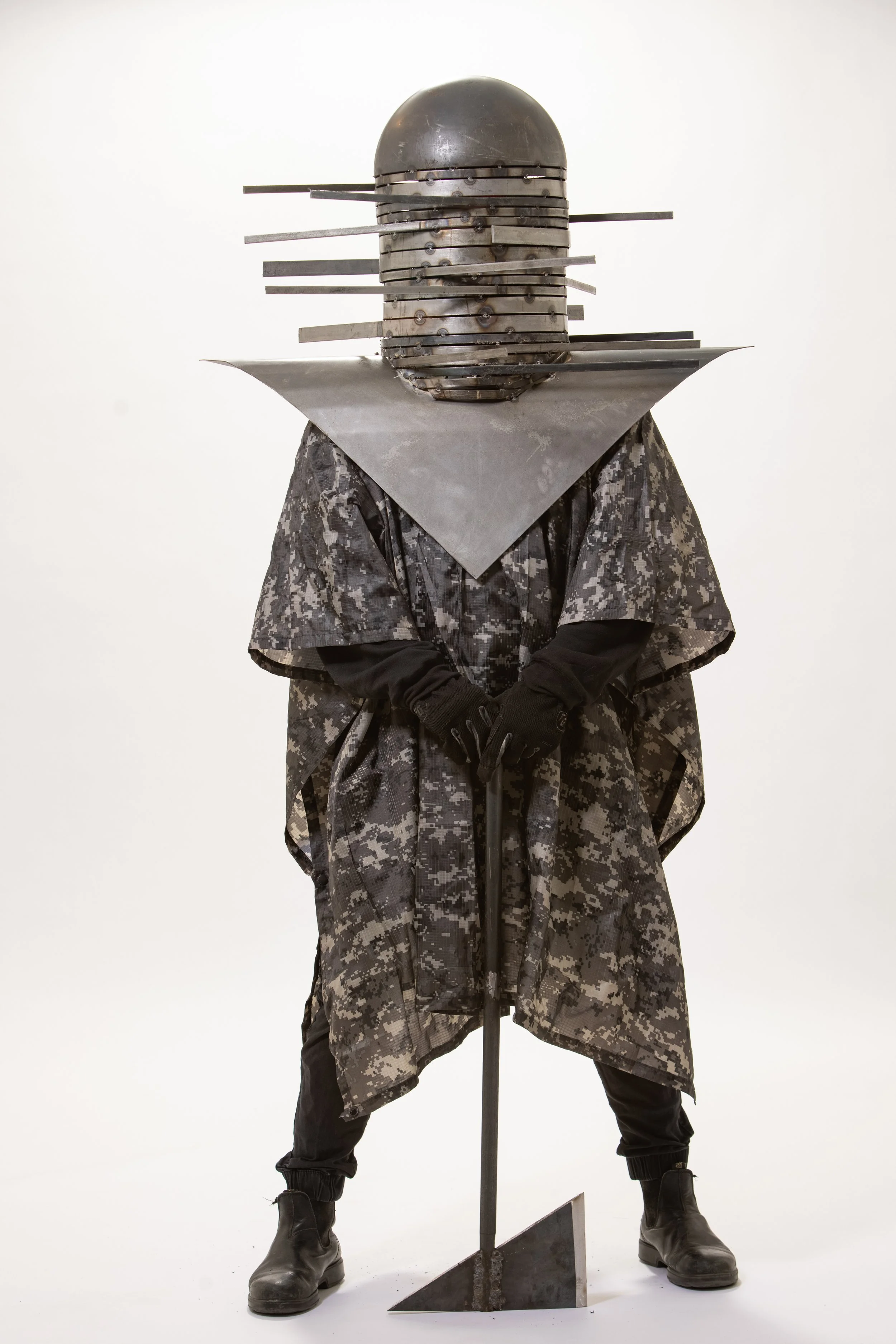 Bake Sale
Helmet: 2'6" x 3' x 1' Flux-core welded mild steel
Axe: 10" x 2'6" x 1" Stick-welded mild steel
Attire: Digital urban camo poncho, rubber gloves, jogger pants, sweatshirt, black leather boots
2020