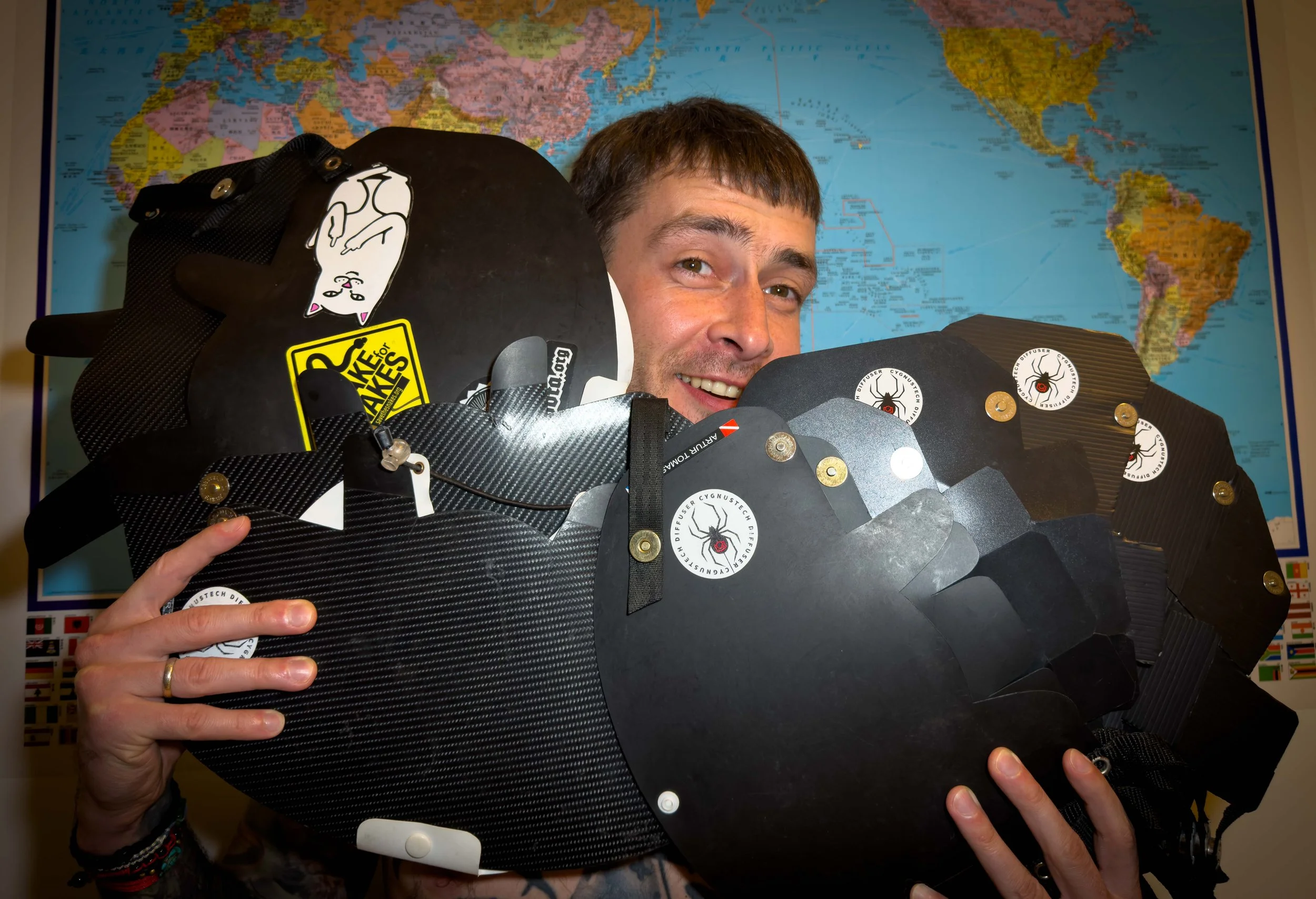 A man smiling and hugging Cygnustech diffusers.