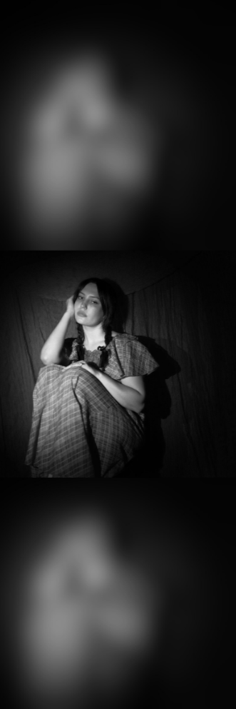 Red-lit portrait of Rina Ford with black and white photo strip