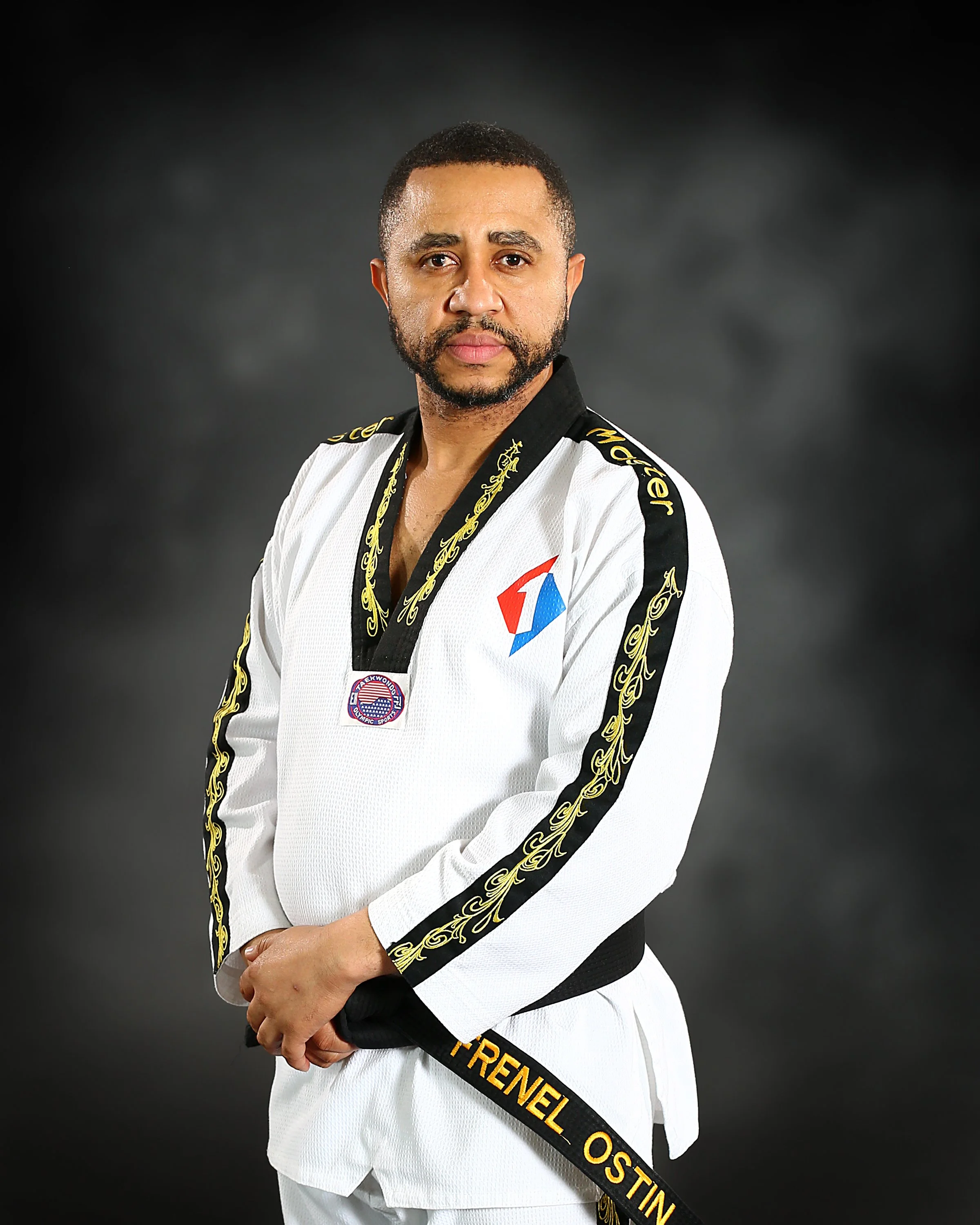 Dr. Frenel OSTIN 
(8th Degree Black Belt - World Taekwondo Chang Moo Kwan & 6th Degree Black Belt - Kukkiwon)