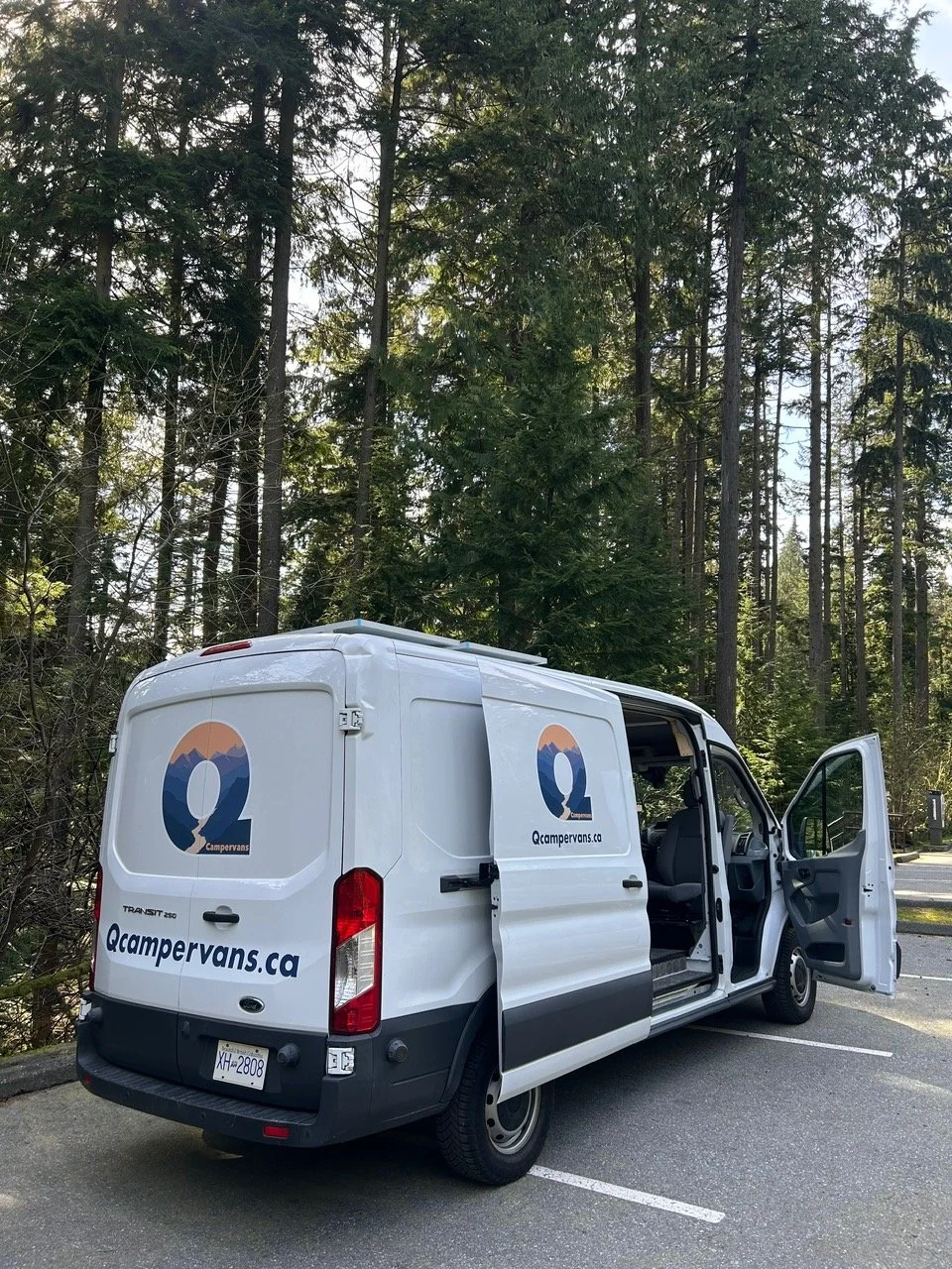 Rico, Q Campervan's rental van. Ford Transit T-250 with solar panels