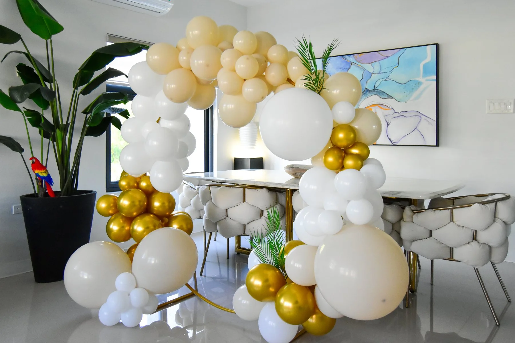 White, champagne and gold birthday balloon display inside Luxe Oasis in Ocho Rios, Jamaica